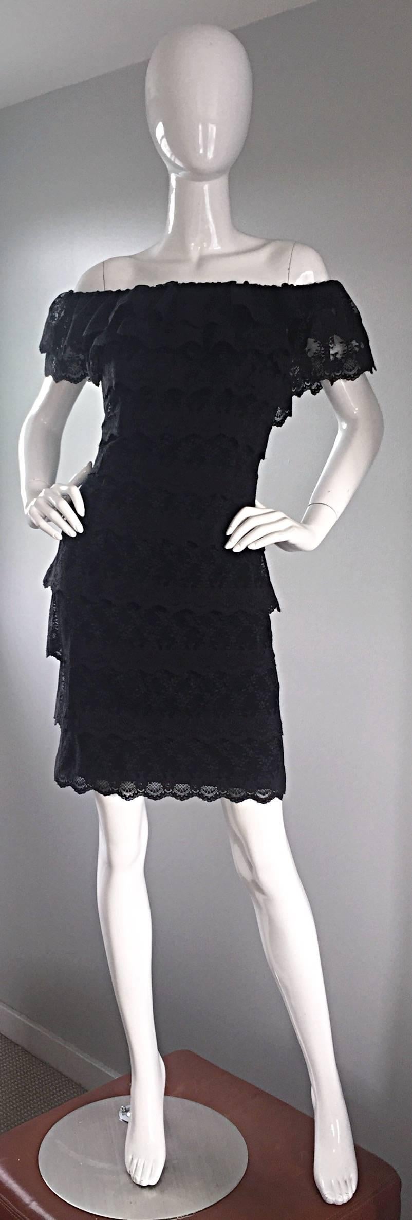 Incredible and flattering vintage TADASHI SHOJI black lace 90s bodycon dress! Words cannot even begin to describe how stunning this dress is on the body! Can be worn on, or off the shoulder. Features panels of black lace throughout, which make for