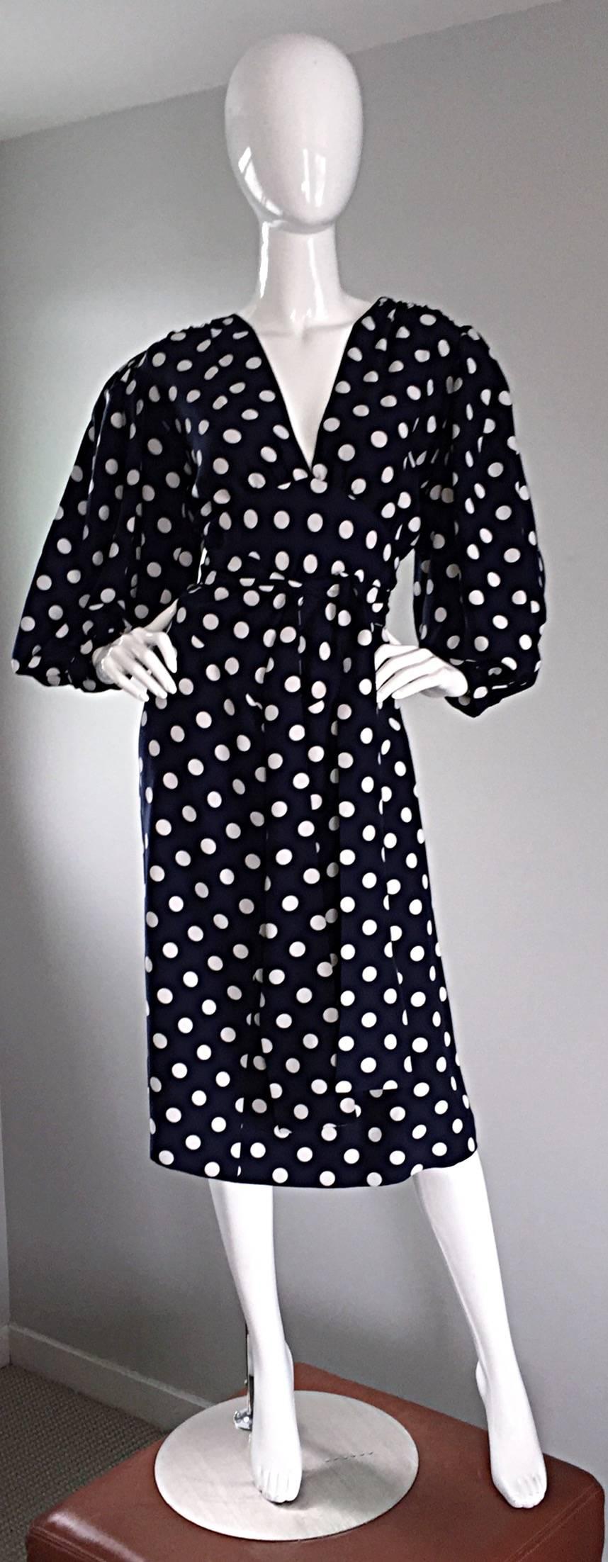 Amazing vintage YVES SAINT LAURENT 'Rive Gauche' silk dress! Features all over navy blue and white polka dots on the most luxurious silk. Flattering attached tie belt, that can be tied loosely, or into a bow. Full balloon sleeves, with buttons at