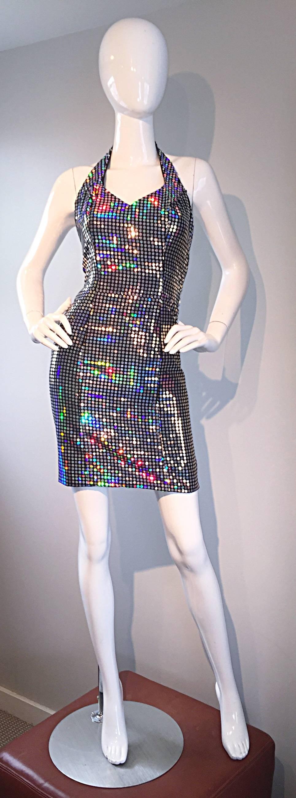 Sexy vintage 90s MIKE BENET holographic bodycon dress! Features all-over mirrors, that make for a colorful holographic effect. Perfect bodycon fit, that was so prevalent in the early 1990s, as it is today. Hidden full zipper up the back, with