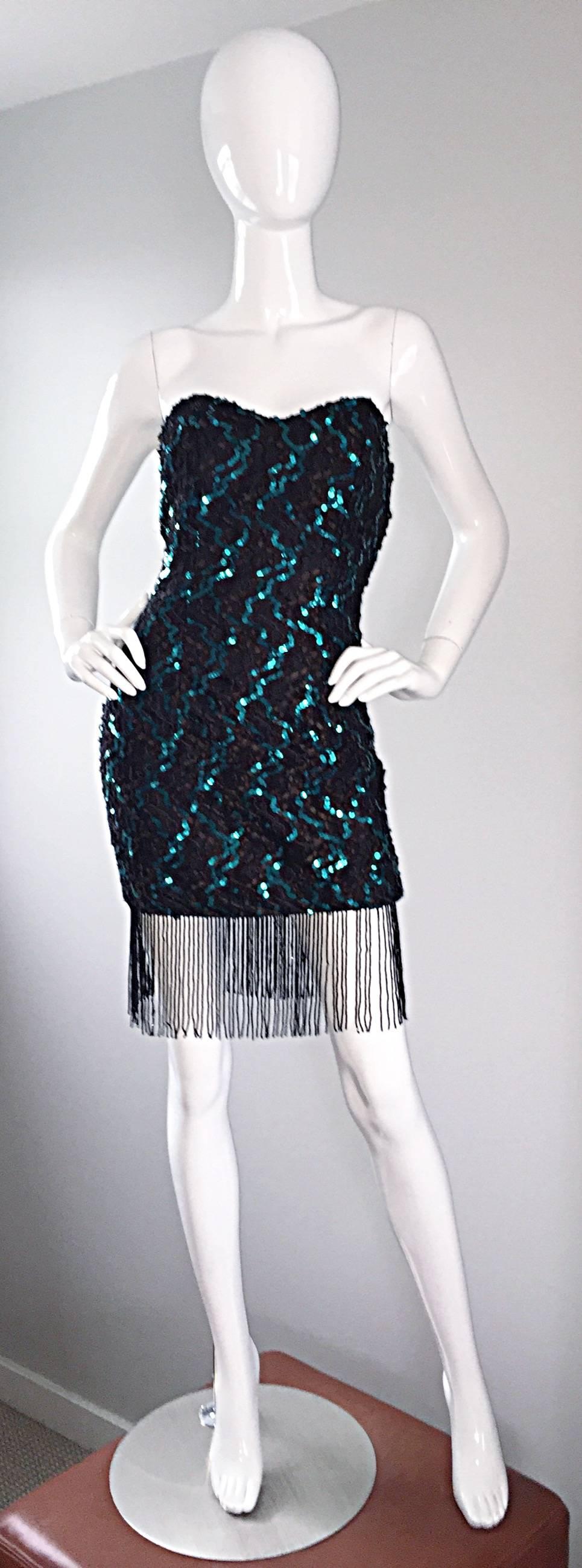 Sexy vintage J. REYNOLDS black and teal lace sequined mini dress, with beaded fringe hem! Amazing hand-sewn teal sequins, with a stunning black lace backdrop. Beaded fringe hem looks amazing on the dance floor! Hidden zipper up the back, with