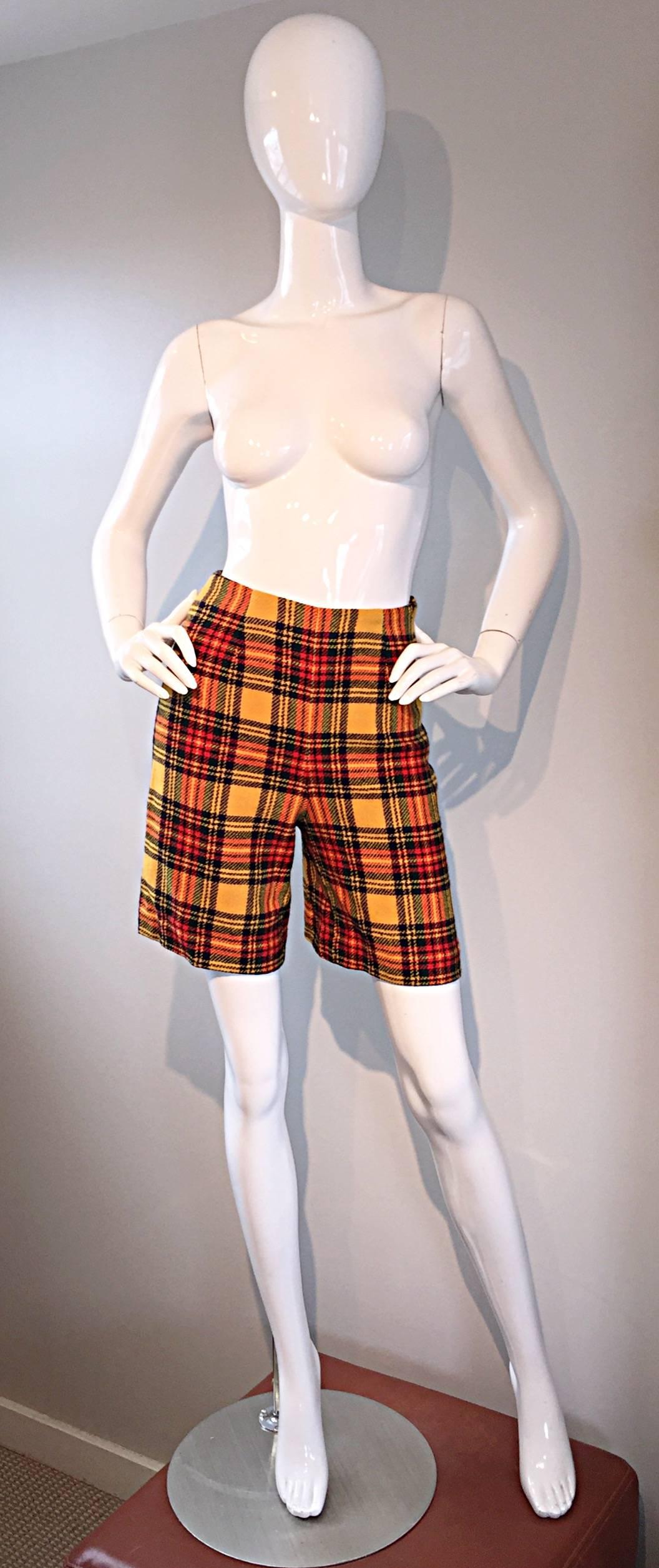 Awesome 1960s women’s high waisted tartan plaid shorts! Features a vibrant plaid of yellow, red, and dark green. Metal zipper up the side. Great fit, that looks good with or without stockings. Chic with a tucked in turtleneck and boots, yet perfect