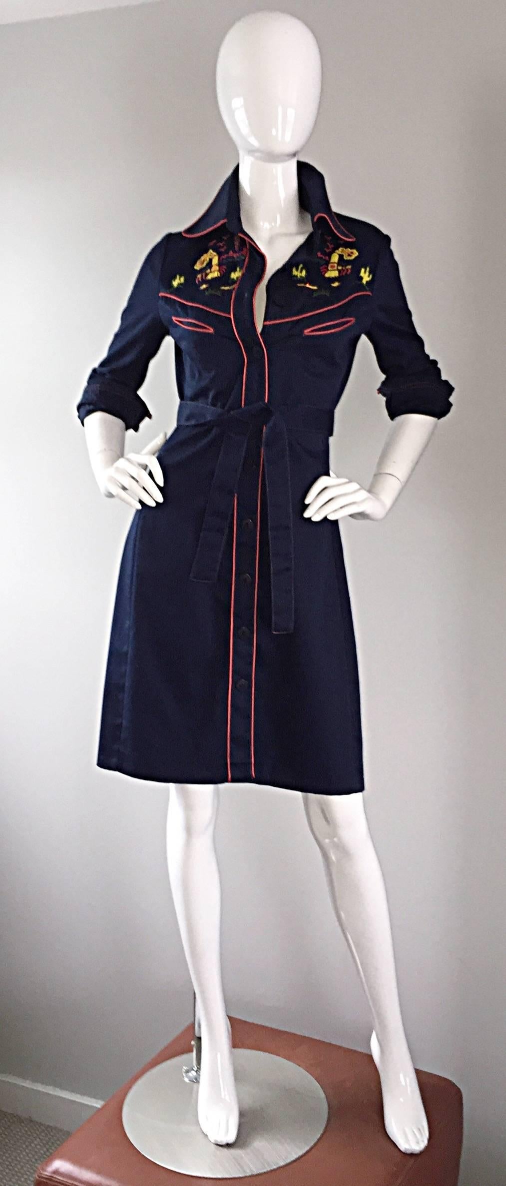 Amazing rare 70s ARISTO KAT beaded 'El Paso' cotton western shirt dress! Navy blue, with red piping at edges. Hand beaded bodice and back. Detachable wrap belt. Features mock buttons up the bodice, with snap closures. Three functional buttons at