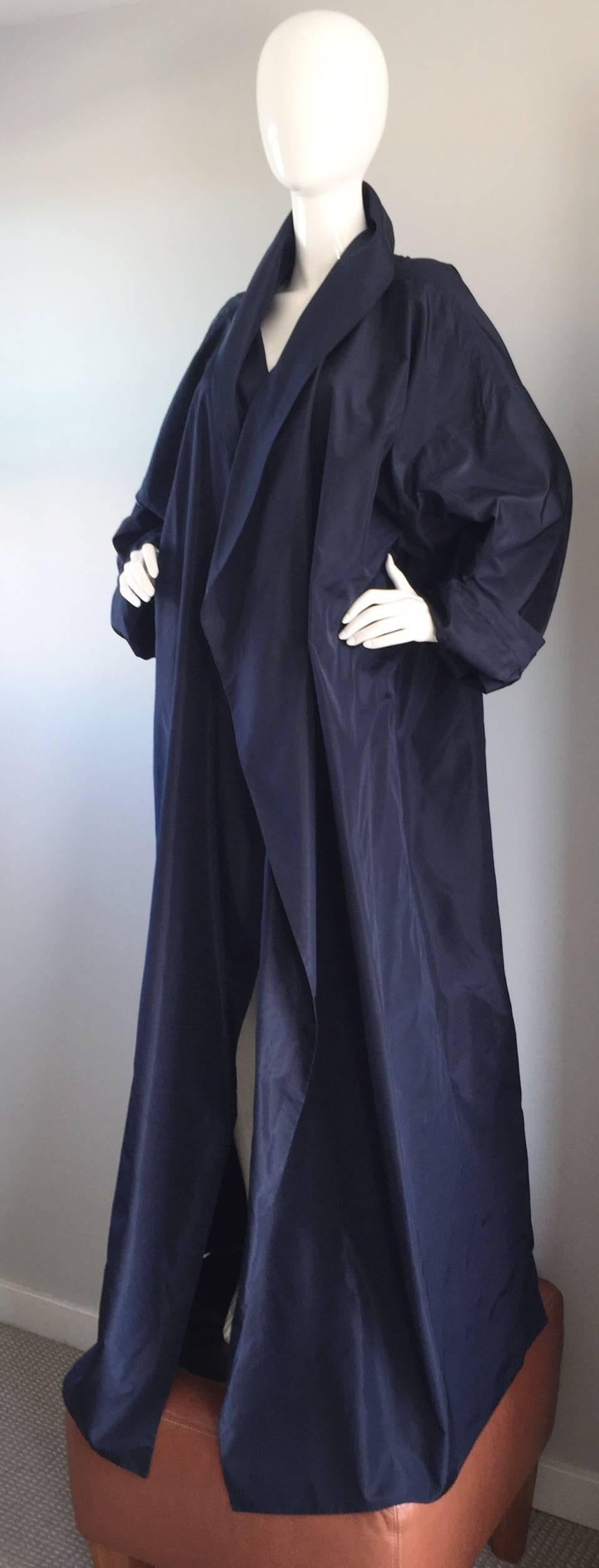 Dramatic vintage PAMELA DENNIS midnight blue silk opera jacket! Incredible amount of volume, featuring a shawl collar. The finest of silks was used on this couture beauty. Functional pockets at both sides of the waist. Hangs perfectly over the body.
