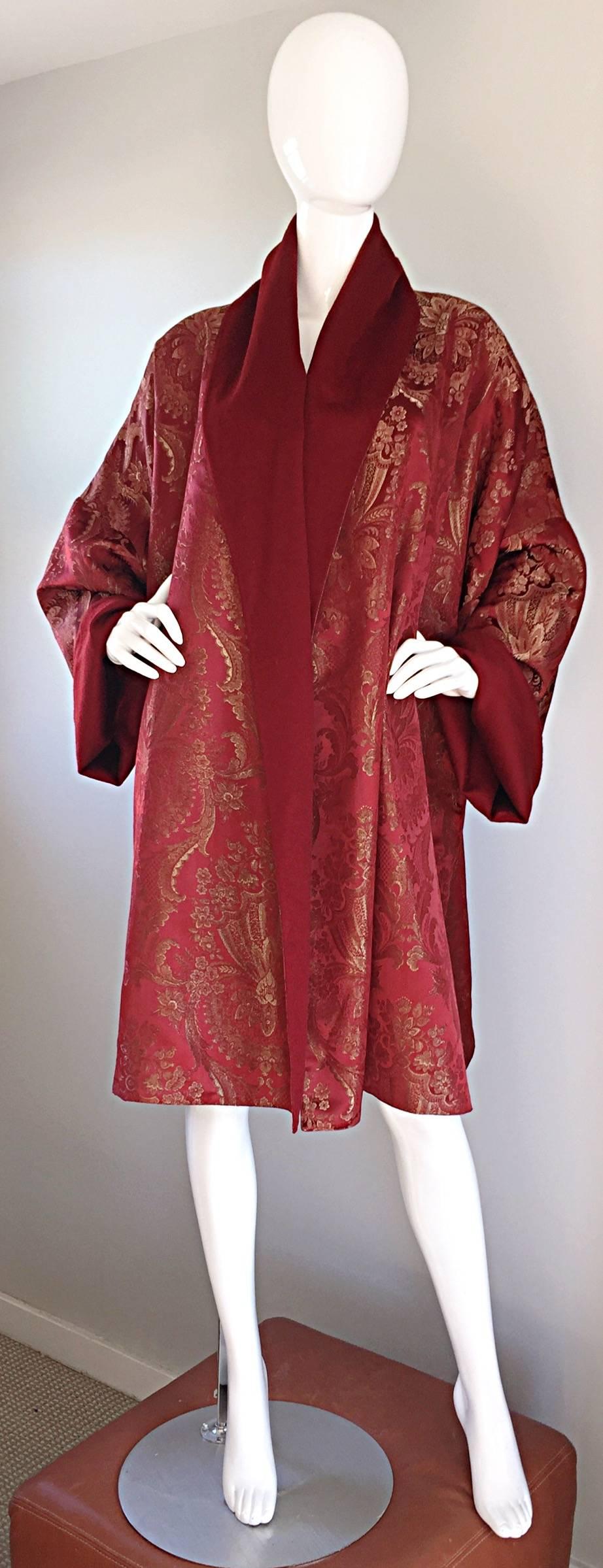Museum worthy vintage ROMEO GIGLI wine colored reversible opera / evening jacket kimono! Fine burgundy silk, with hand-sewn gold silk threaded paisley throughout. Reversible to a cashmere burgundy. Pockets at both sides of the waist. Couture