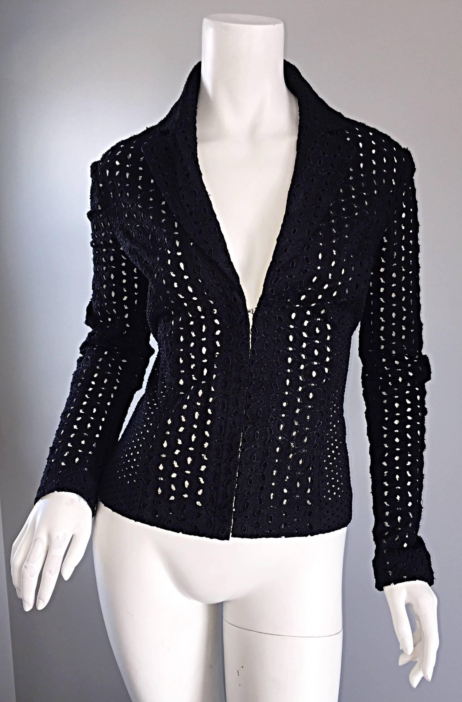 Incredible and important vintage 90s 
GIANNI VERSACE COUTURE (Pre-Death) black fitted eyelet blazer! Features allover eyelets throughout the entire piece. SIgnature blazer collar and lapels. A unique take on the classic black blazer. Features