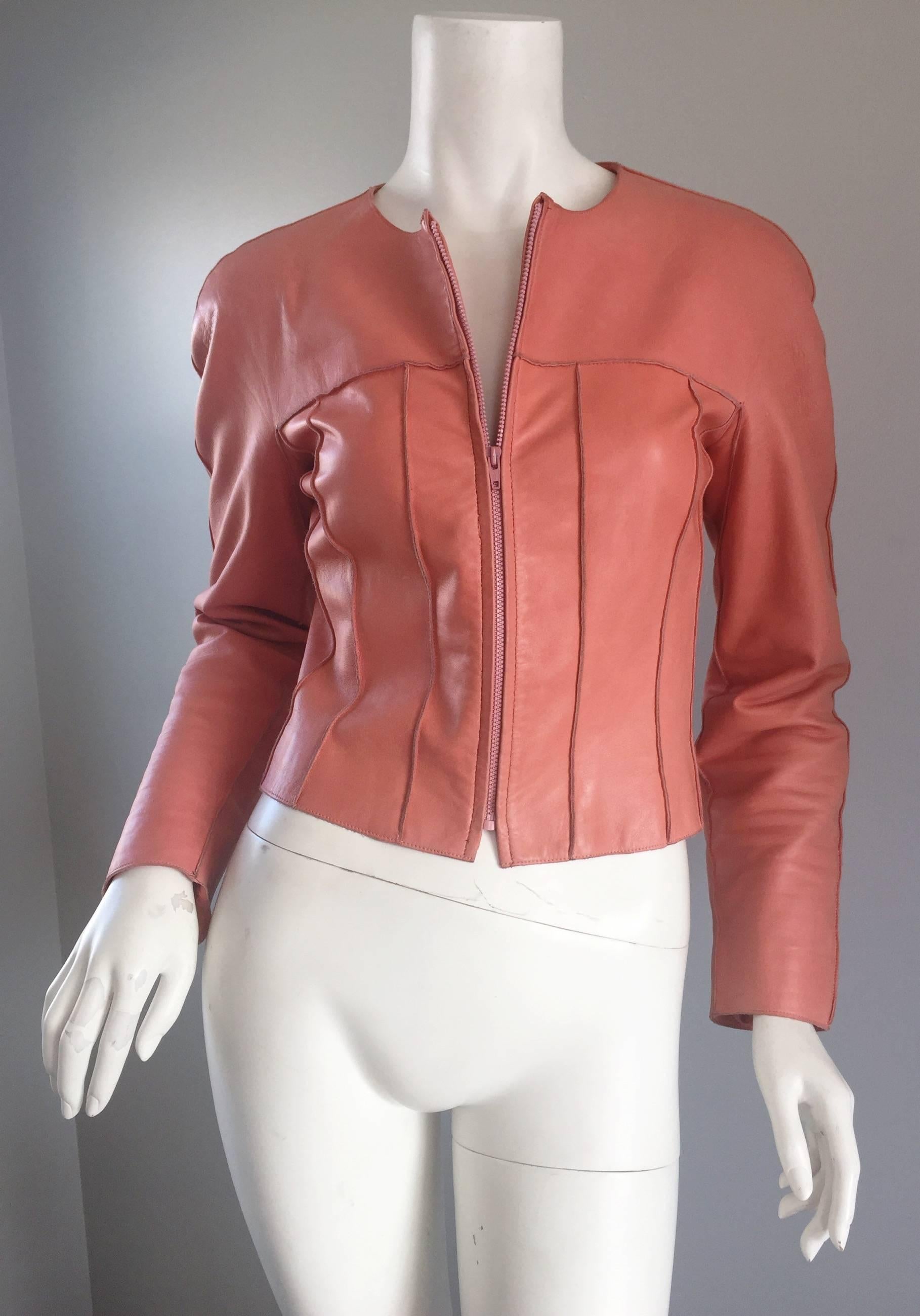 Rare CHANEL 1990s/90s leather jacket from the runway Spring Summer 1999 season. Beautiful medium pink color that matches pretty much anything! Slimming raised seams on the front and back. Perfect tailored fit, with a full zipper up the front. Can