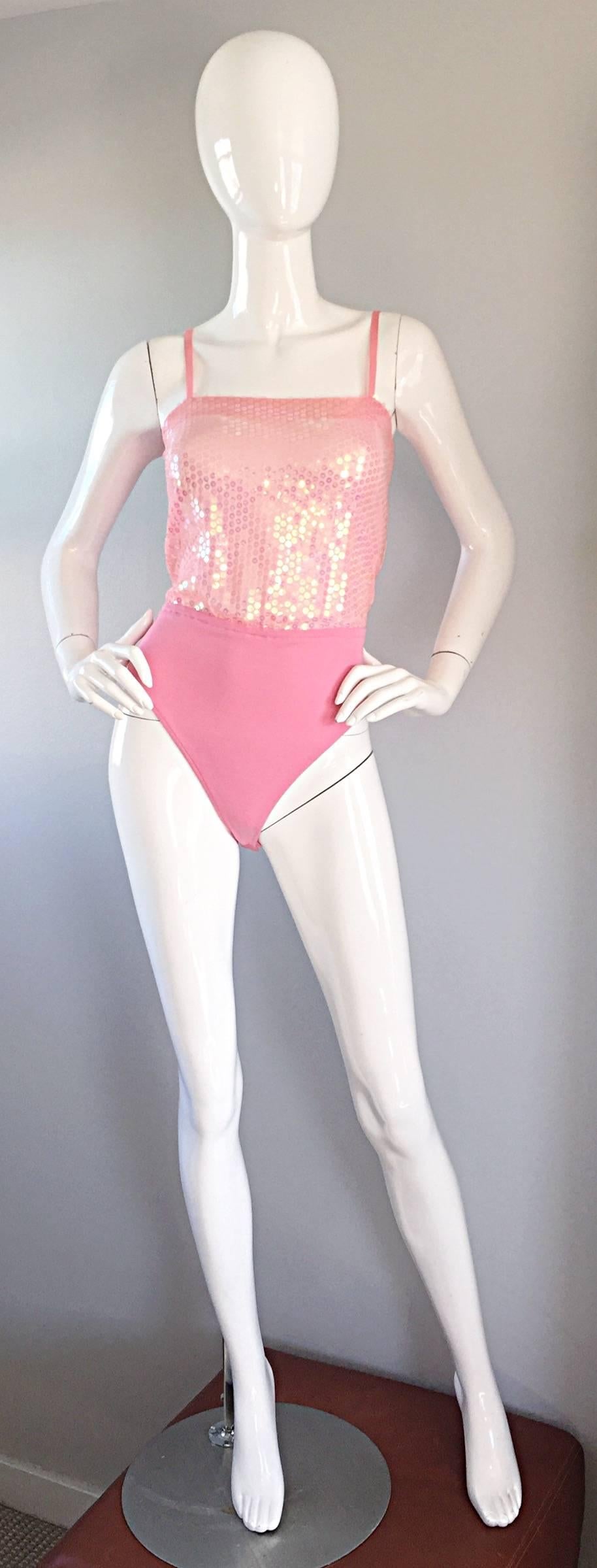 Amazing vintage ESCADA, by MARGARETHA LEY pink sequined bodysuit! Features a silk bodice with hundreds of pink sequins hand-sewn throughout the front and back. Extremely flattering, and super versatile. Perfect paired with shorts, jeans, trousers,