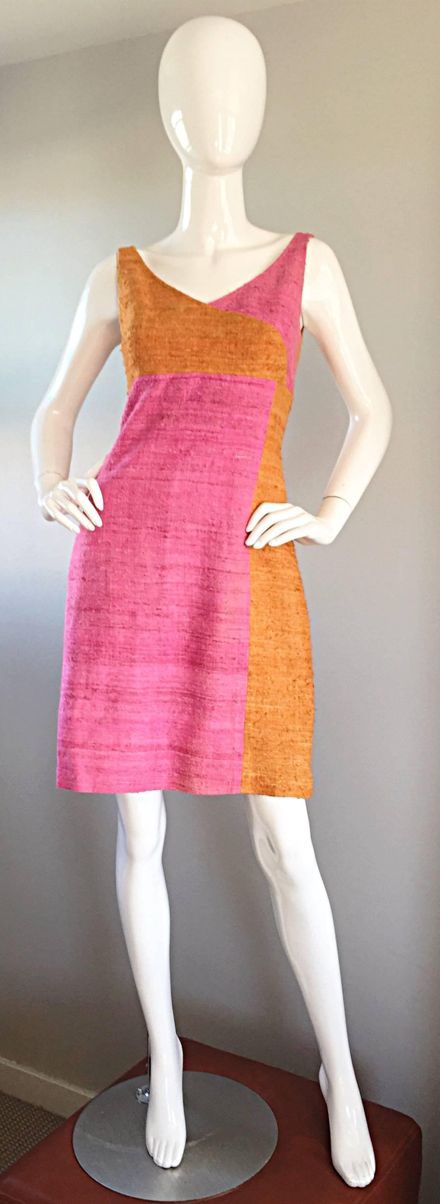 Adorable 1960s pink and burnt orange color block mod A-Line dress! Color block design on the front and solid burnt orange on the back. No fabric tag, but feels like a silk and linen blend. Fully lined, with a newly replaced hidden zipper up the