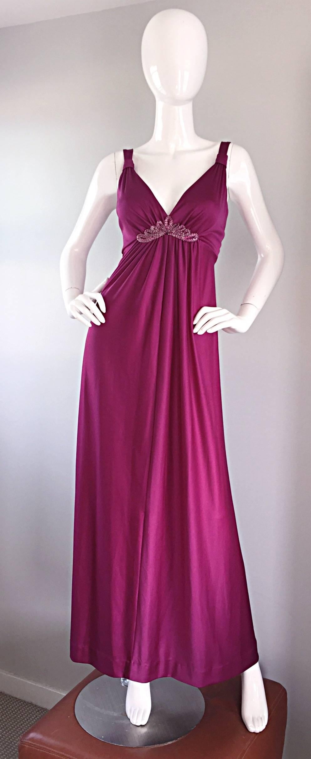 Sexy 1970s wine colored Grecian maxi dress, and matching shrug! Slinky maxi dress, with beading detail at the bust. Flattering gathers throughout the bodice, which not only look good, but leave some room to breathe! Full metal zipper up the back,