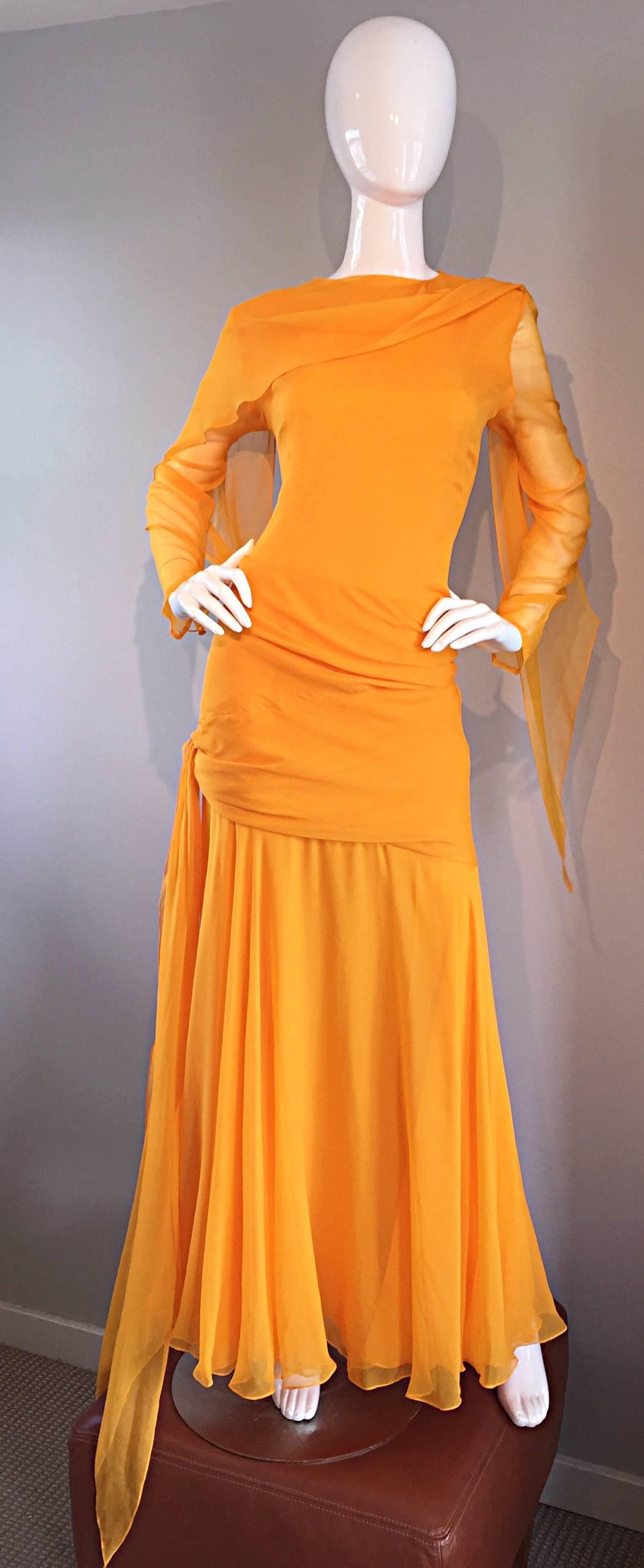 Sensational vintage BILL BLASS silk chiffon gown in the most beautiful marigold yellow color! Layers and layers of the finest chiffon that looks amazing with movement. Attached chiffon scarf, which can be left dangling in the front, or thrown over