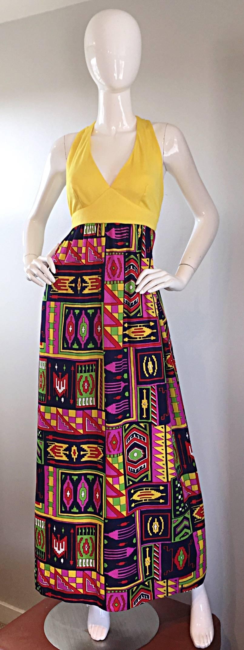 Incredible 70s KELLY ARDEN maxi dress and fringed shawl! Dress features a 'caged' back, with two gold buttons at top back neck. Halter style. Full skirt features bright colors in an abstract 'Southwestern' print. Full zipper up the back, with