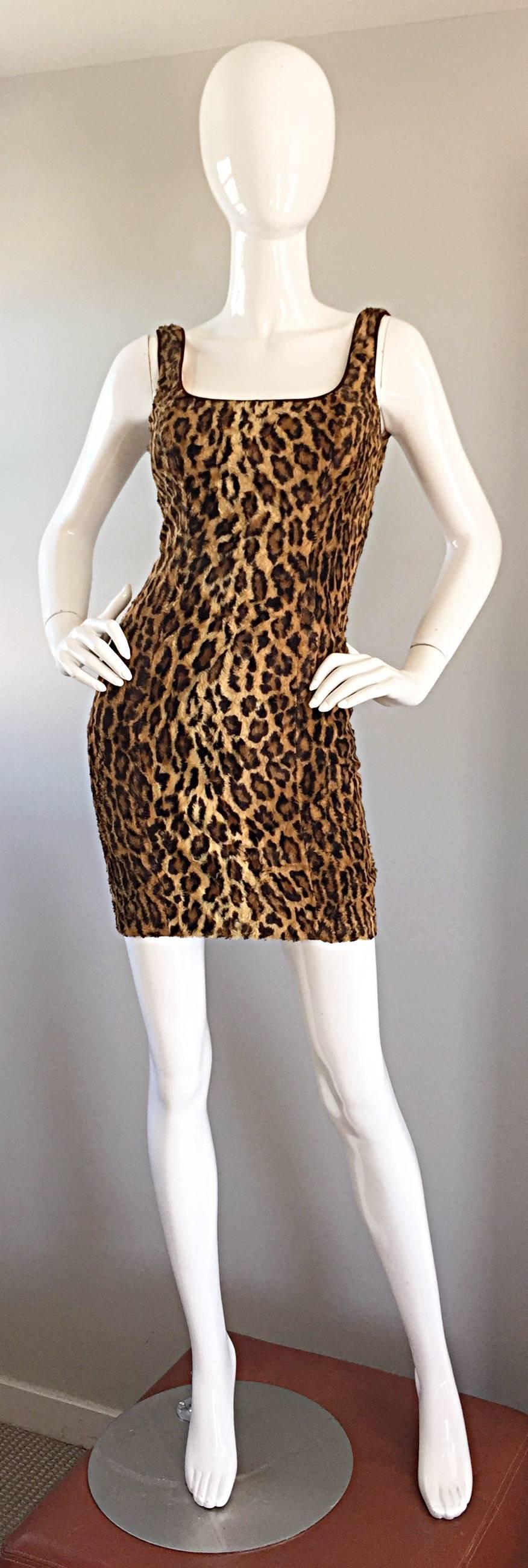 Sexy early 1990s TADASHI SHOJI faux fur leopard print BodyCon dress! A unique twist on the classic leopard dress, with the faux fur material. Hugs the body, and looks sensational on! Fully lined, with a hidden metal zipper up the back, and