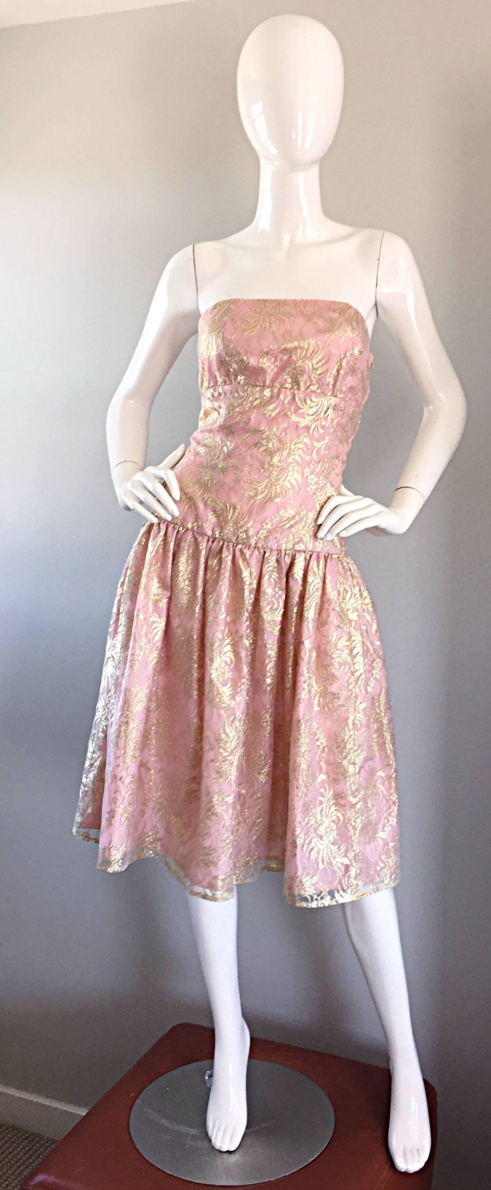 Prettiest vintage Halston strapless cocktail dress! Vibrant light pink, with an overlay of gold metallic lace. Slight drop waist, with a full skirt (could easily put a crinoline/petticoat under for a fuller skirt). Hidden zipper up the side, with