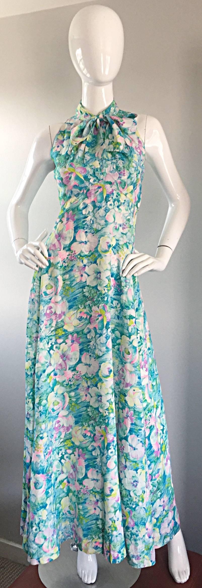 Beautiful early 70s, late 1960s / 60s watercolor printed maxi dress! Features a beautiful watercolor floral print in blues, teals, purples, pinks and greens! Attached pussycat bow at neck can be worn tied in a bow or left loose. Wonderful trapeze