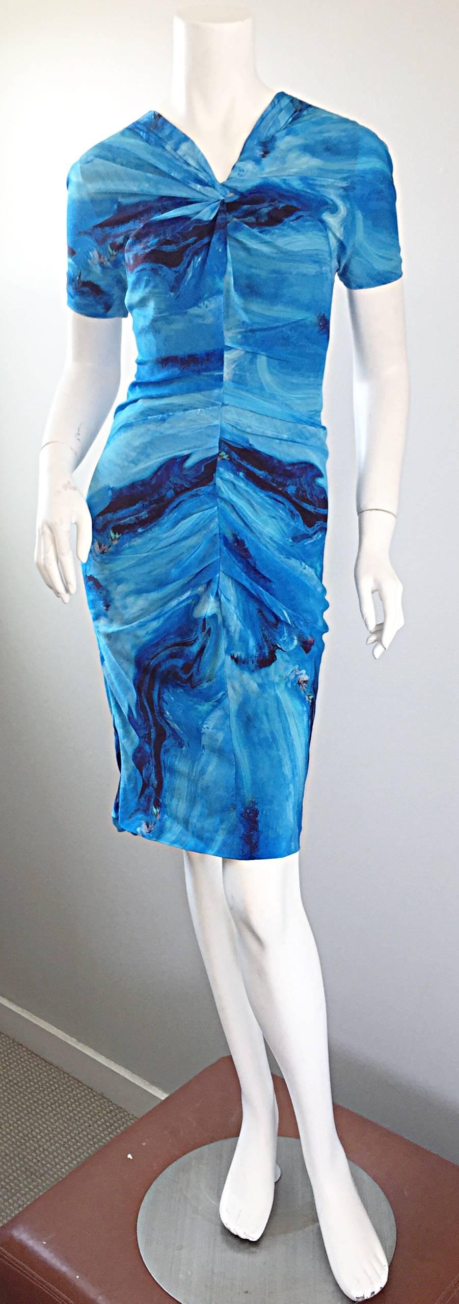 Amazing and rare vintage VERA WANG Collection silk ruched dress from 1995! Features an incredible vibrant blue 3-D watercolor ocean/wave print throughout, with speckles of colors sporadically to mirror sparkles from sunlight. Twisted neckline that