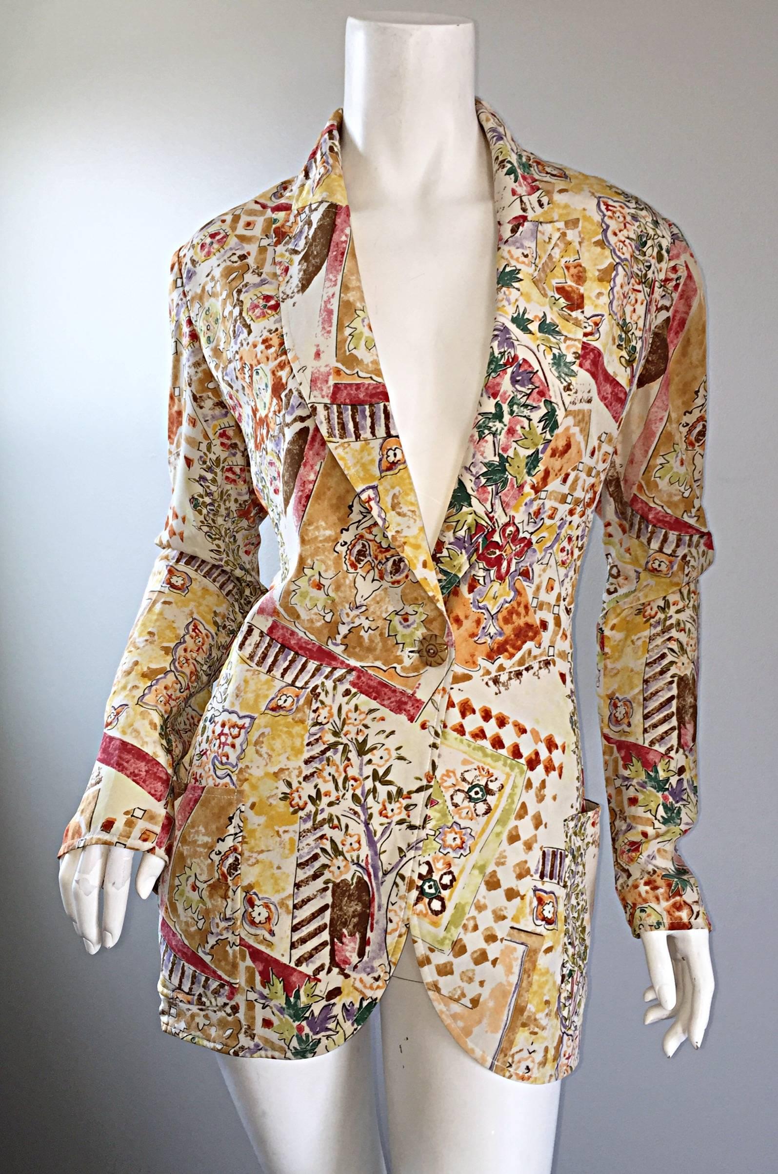 Beautiful vintage EMANUEL UNGARO mixed media printed silk blazer! Features an all over novelty print with a 'garden' theme. Single breasted, with decorative buttons (one at bodice, the other two at each sleeve cuff). Functional pocket at each side