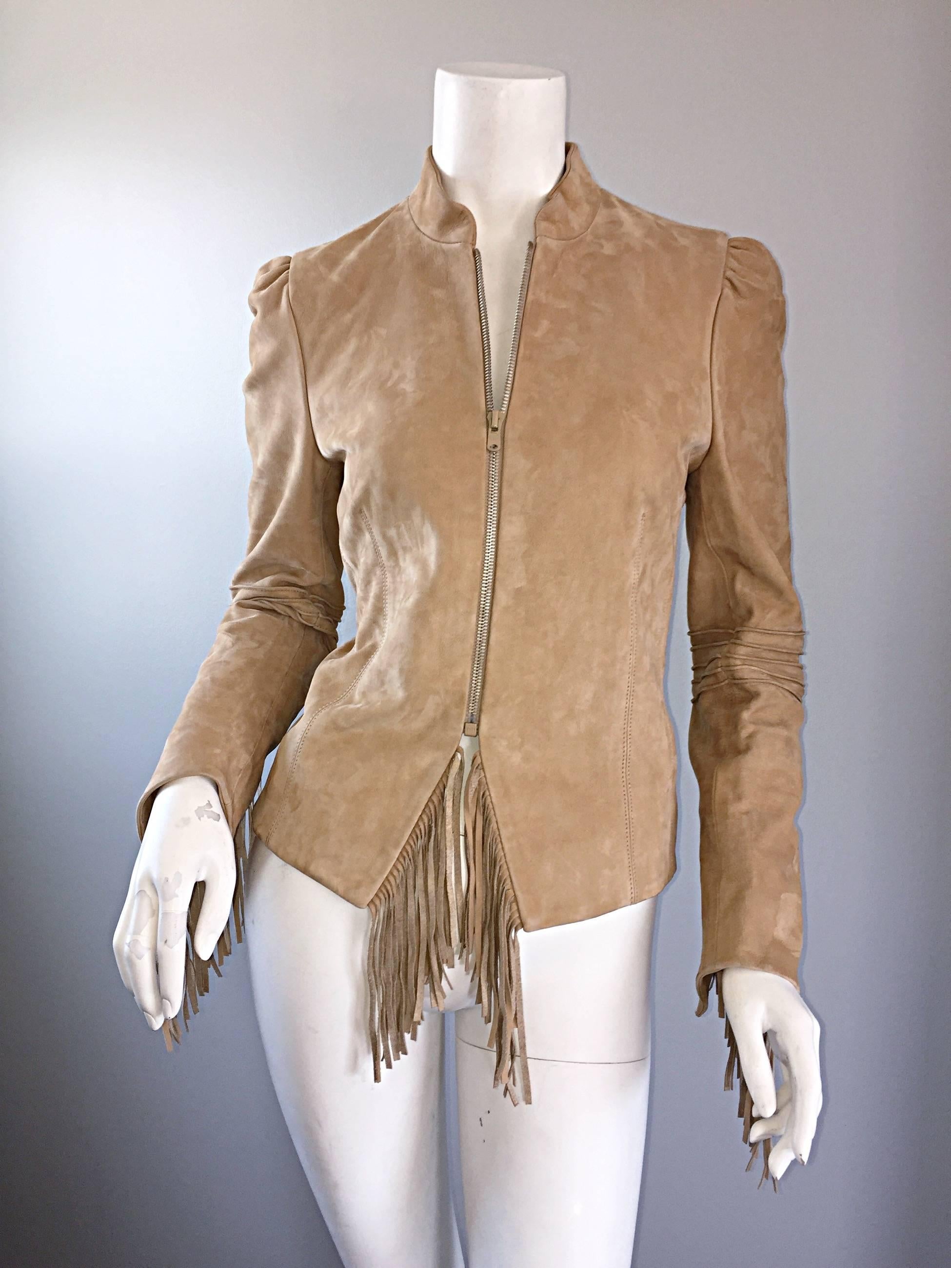 Absolutely amazing early 2000s KATAYONE ADELI light tan leather fringed Boho chic jacket! Never worn, and retailed for $2,000 in 2001! Features the most butter soft leather you will ever feel! Fringes at each sleeve cuff, at each side of the waist,