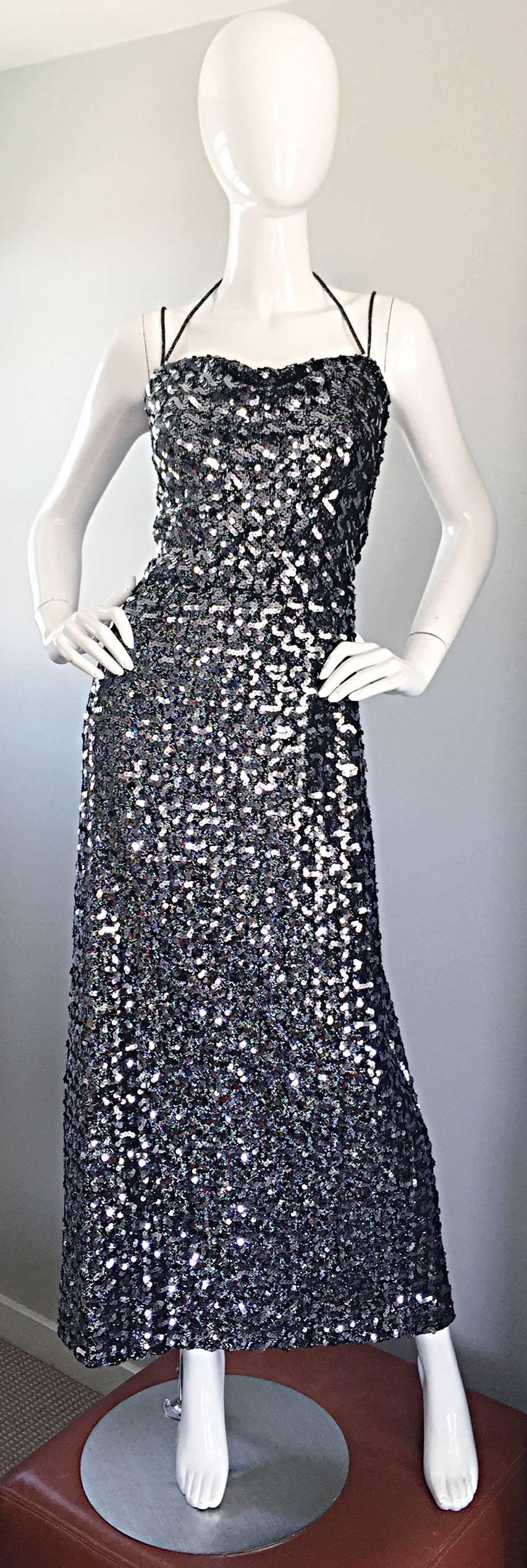 Incredible 70s NORMAN BERG for BUCKNER'S Silver knit halter maxi dress! Thousands of hand-sewn sequins, with a flattering draped bodice. Two thin straps at each arm with a tie halter neck. Hidden zipper up the back with hook-and-eye closure. Looks