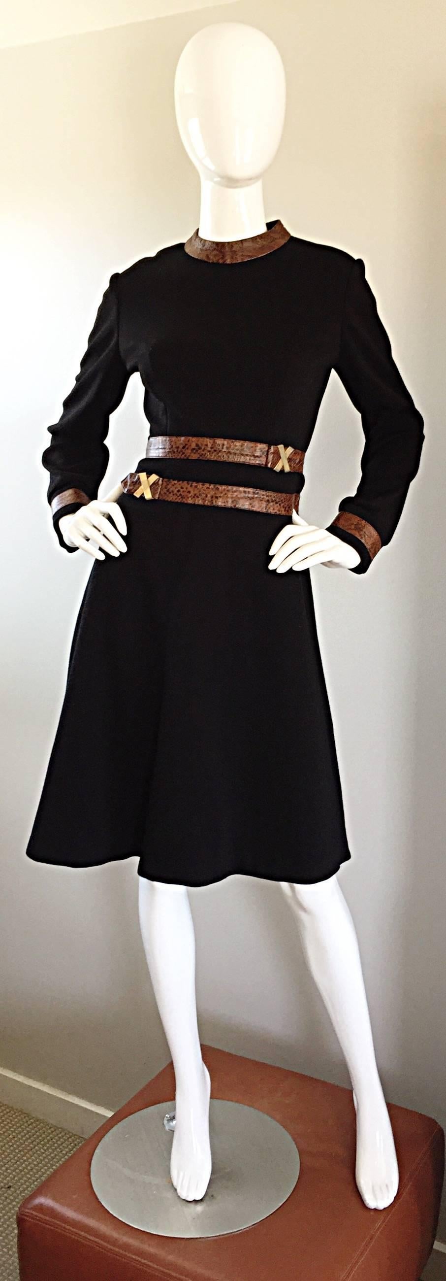 Rare, and simply stunning vintage 60s LOUIS FERAUD long sleeve A-Line dress! Jet black knitted wool, with alligator embossed brown leather accents at waist and collar. Gold/brass 'Paloma Picasso' style metal X's on each side of the waist. Sleek