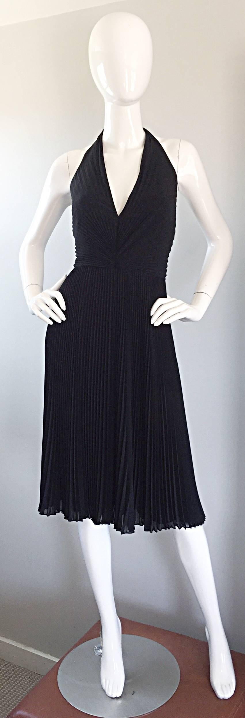 Beautiful 90s CARMEN MARC VALVO black silk knife pleated halter dress! Reminiscent of the white halter dress Marilyn Monroe made famous. Super flattering on the body, and looks fantastic with movement (perfect on the dance floor)! Hidden zipper up