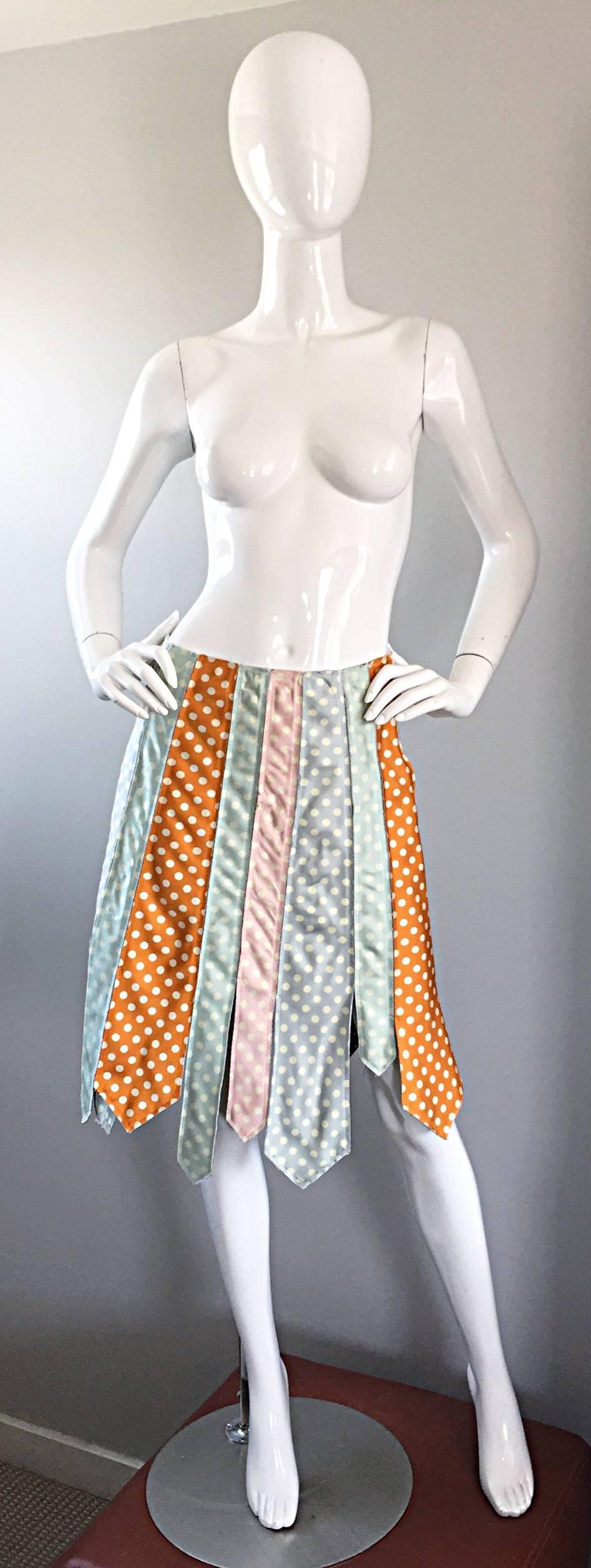 Super rare vintage PAUL SMITH skirt from his first women's collection in 1993! This collectible skirt is all silk and features panels of polka dot printed silk shaped men's ties. Light blue, pink and burnt orange colors. Metal zipper up the side