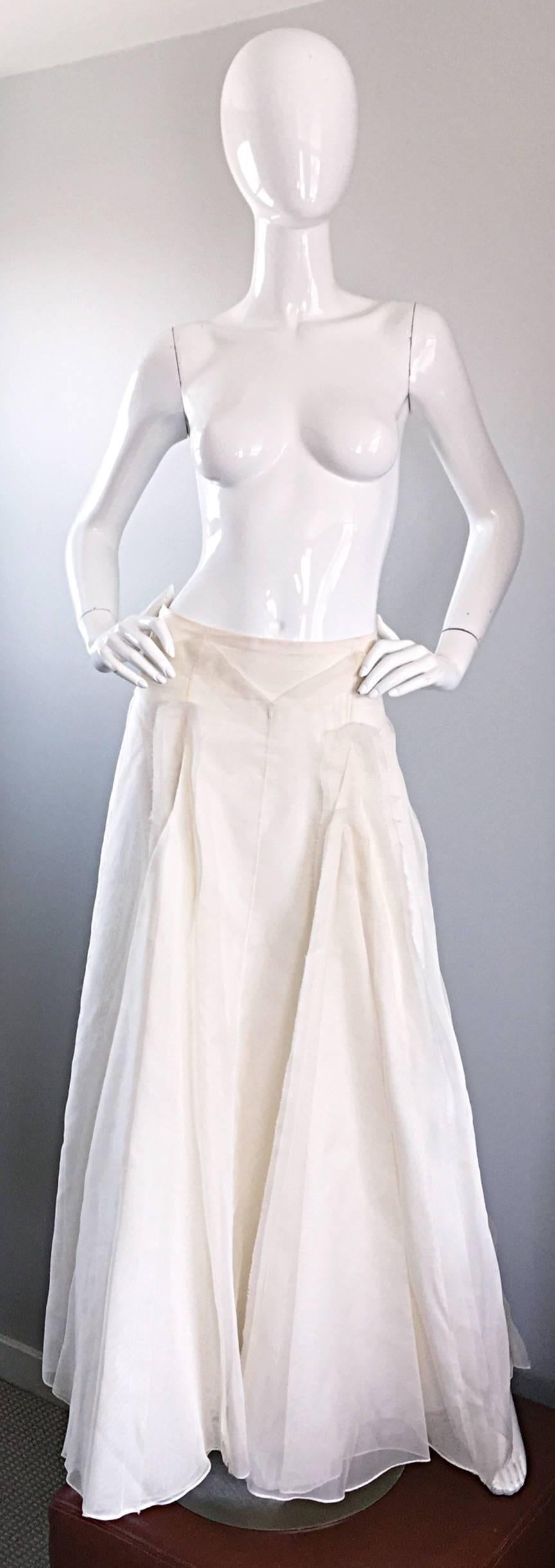 Stunning vintage CAROLINA HERRERA off-white/ivory ball skirt! Dramatic layers of chiffon and the finest silk faille make for an extra full skirt! Features hand-sewn chiffon patches on each panel. Slimming waist details. Hidden zipper up the side