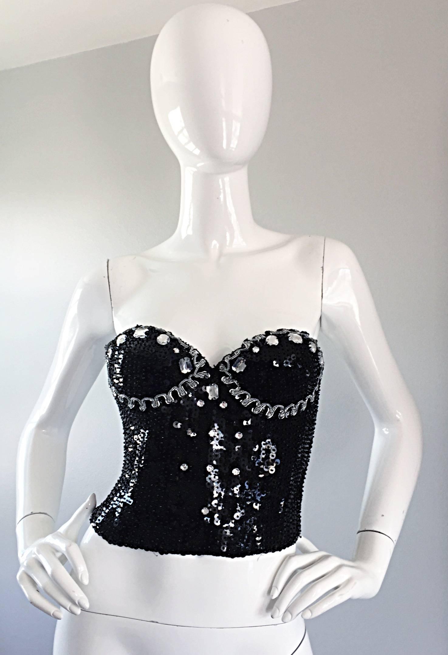 Sexy vintage DANA DEATHERAGE black corset / crop top! Features hundres of hand-sewn sequins, beads, rhinestones and crystals. Silver metallic trim at bust. Two rows of hook-and-eye closures will adjust to fit. Great with a high waisted leather