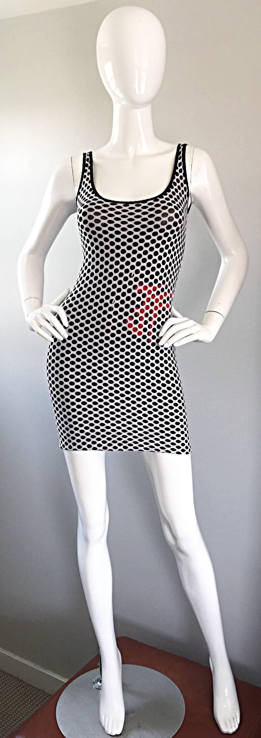 Sexy 1990s GIANFRANCO FERRE black and white fishnet mini dress! Black cotton jersey with white fishnet. Red hand-sewn seed beads at side waist subtly spell out the GFF logo. Classic bodcon fit that is super flattering on the body. Perfect with heels