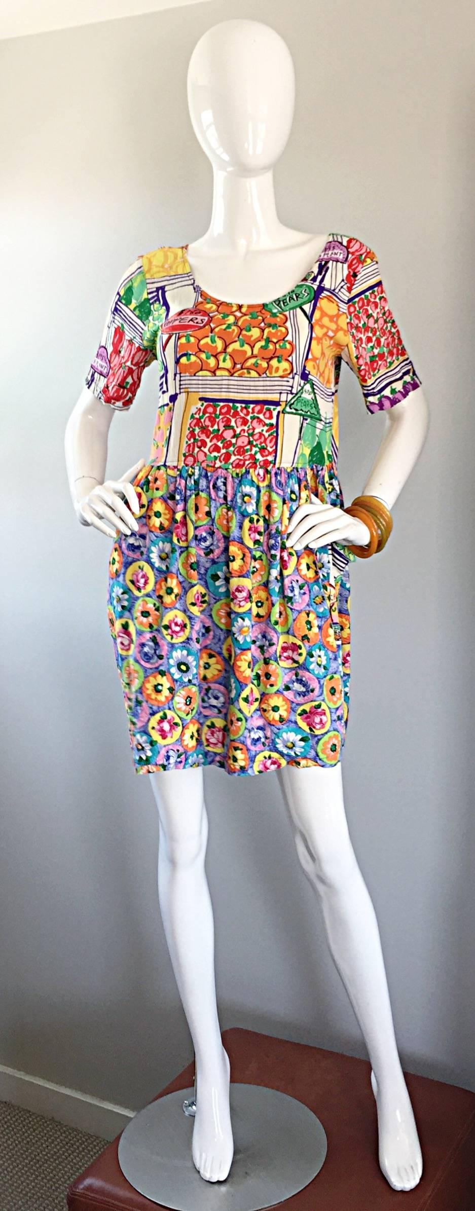 Simply amazing 1990s JAM'S WORLD dress! Very colorful, with awesome prints of fruit and vegetable stands throughout the bodice, with flowers printed throughout the skirt. Pockets at each side of the skirt. A perfect example of the whimsical designs
