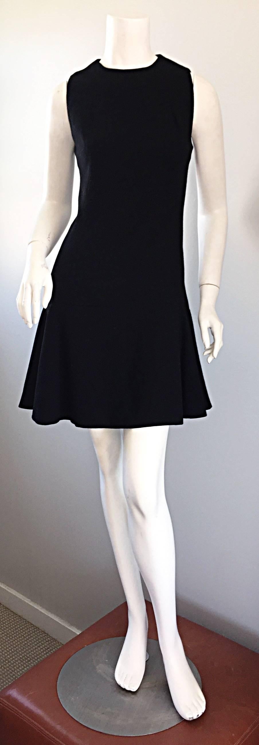 The ultimate vintage 60s GEOFFREY BEENE classic little black dress! It is rare to find early Beene pieces like this! Softest black fine wool that drapes over the body beautifully! Tailored flattering fit, with a soft drop waist and pleated trumpet