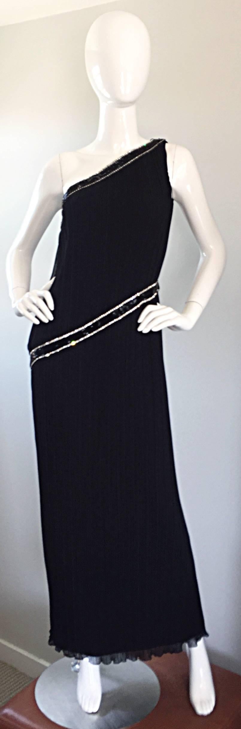 Beautiful vintage Late 1970s / 70s JILL RICHARDS for I. MAGNIN black chiffon silk plisse pleated one-shoulder floor length Grecian toga gown! Adorned with hundreds of hand sewn black beads and rhinestones at collar and waist. Such a flattering