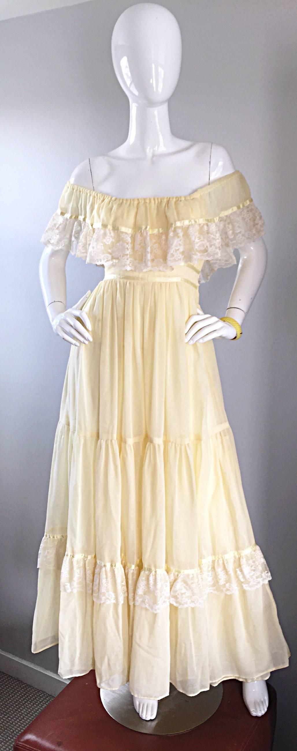 Breathtakingly beautiful 70s pale yellow soft cotton voile and lace maxi dress! Features an incredible amount of craftsmanship, with heavy attention to detail. Gives off just the right amount of Bohemian meets prarie peasant! Lace detail at bodice,