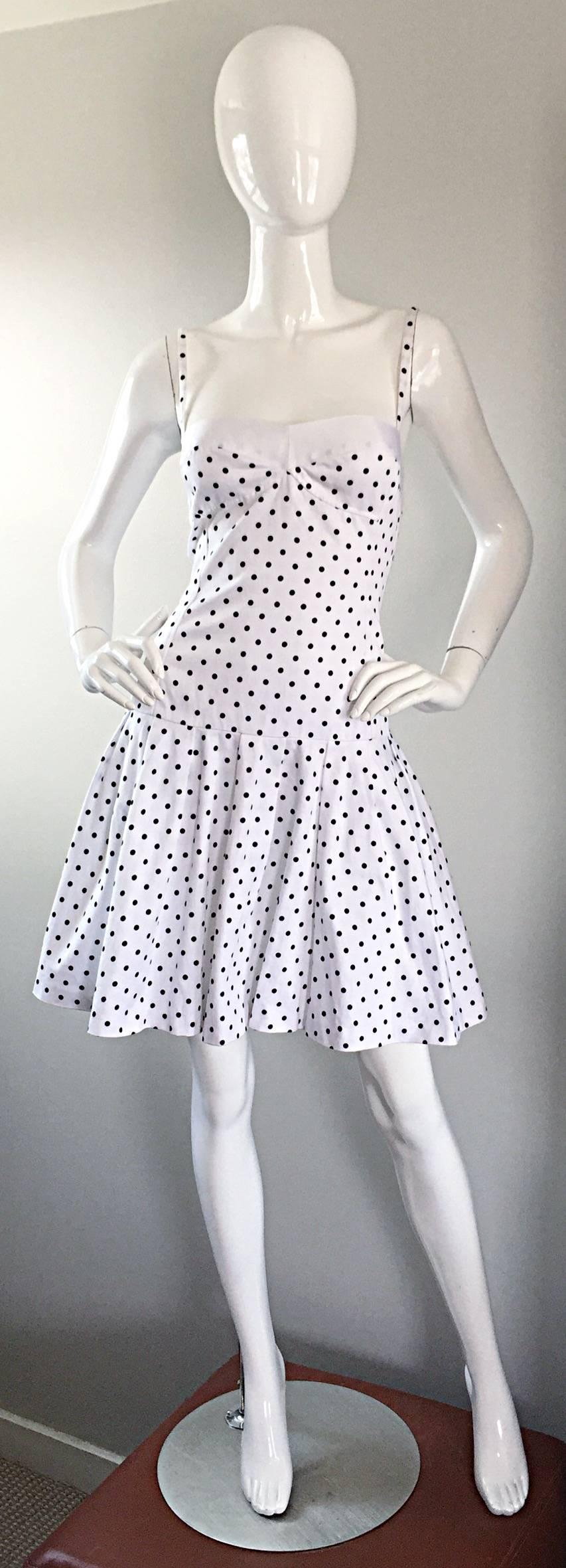 Incredible vintage 80s ENRICO COVERI white and black polka dot printed dress! Features all over polka dots, with white silk grosgrain ribbon detail at bust. Super flattering bodice, with an attached flared skirt! Hidden zipper up the back with