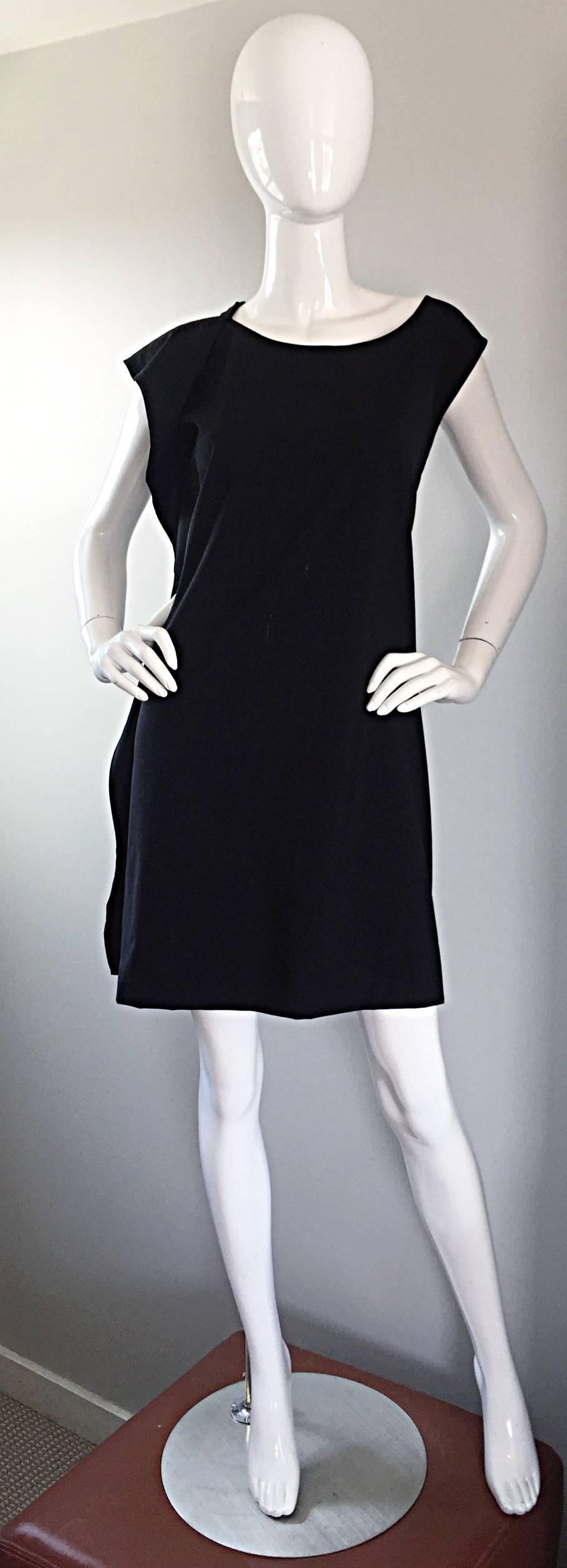 Signature JIL SANDER early 90s black asymmetrical draped dress! Wonderful style that screams fashionista! A collector's dream that is just the perfect amount of slouchy...Draped detailing on the left side makes for a current Avant Garde look. Super