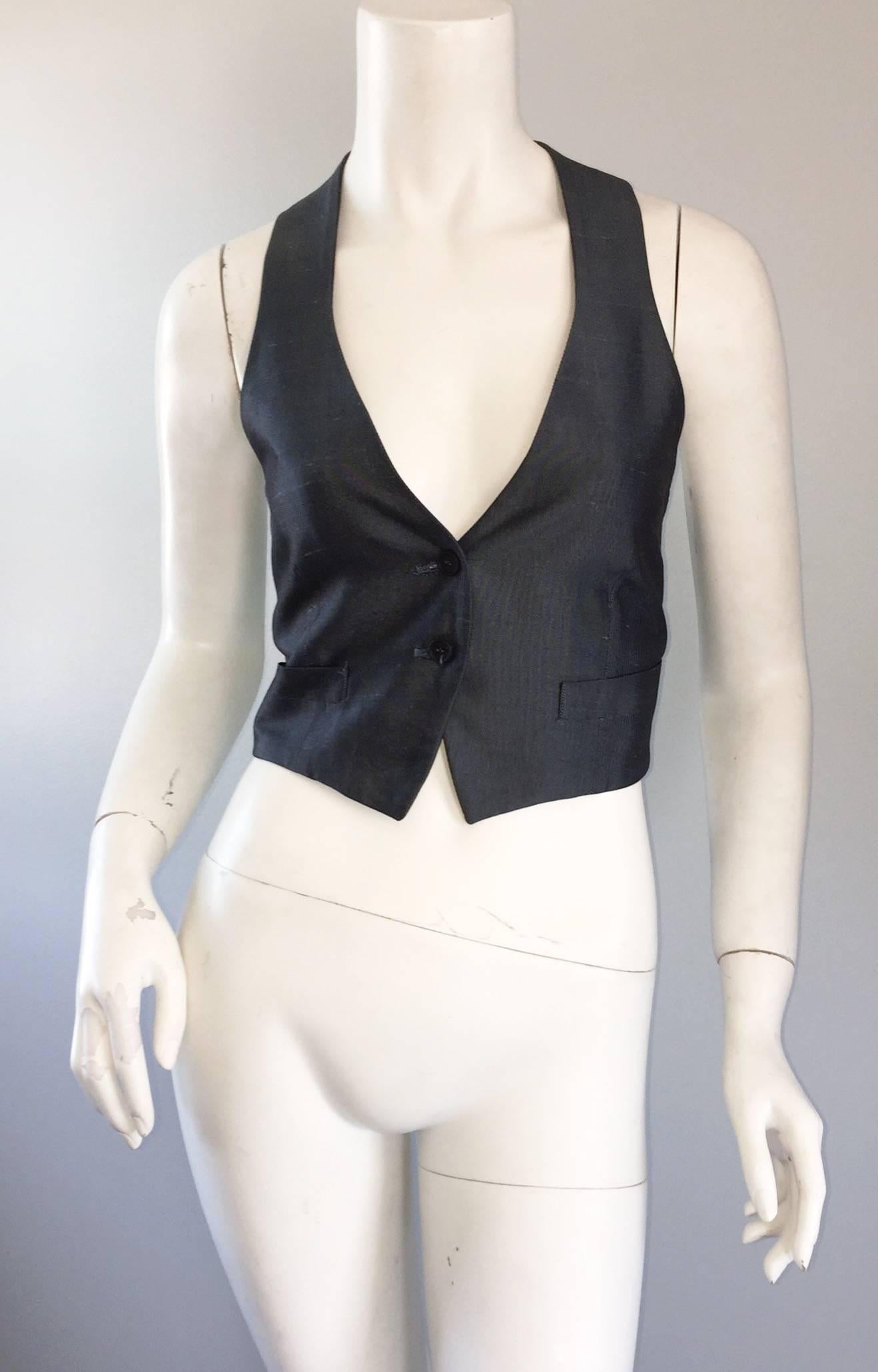 Chic 1990s ROMEO GIGLI blue / gray cropped waistcoat vest! Features two buttons up the bodice, one pocket at each side of the waist, and an adjustable strap on the back waist to tighten the shape. Wonderful contrasting silk green back. Perfect with