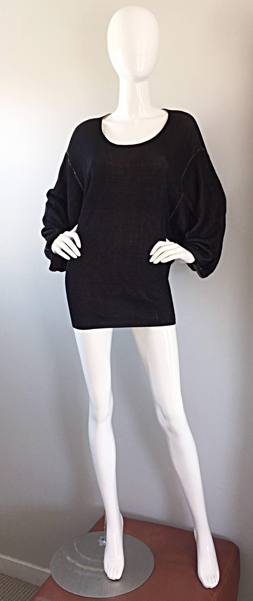 Amazing early AZZEDINE ALAIA black mini dress or sweater tunic! Incredible design by the body conscious designer, whom always produces figure flattering designs. Stitching at the bottom back really accentuates the rear! Chic dolman sleeves make this
