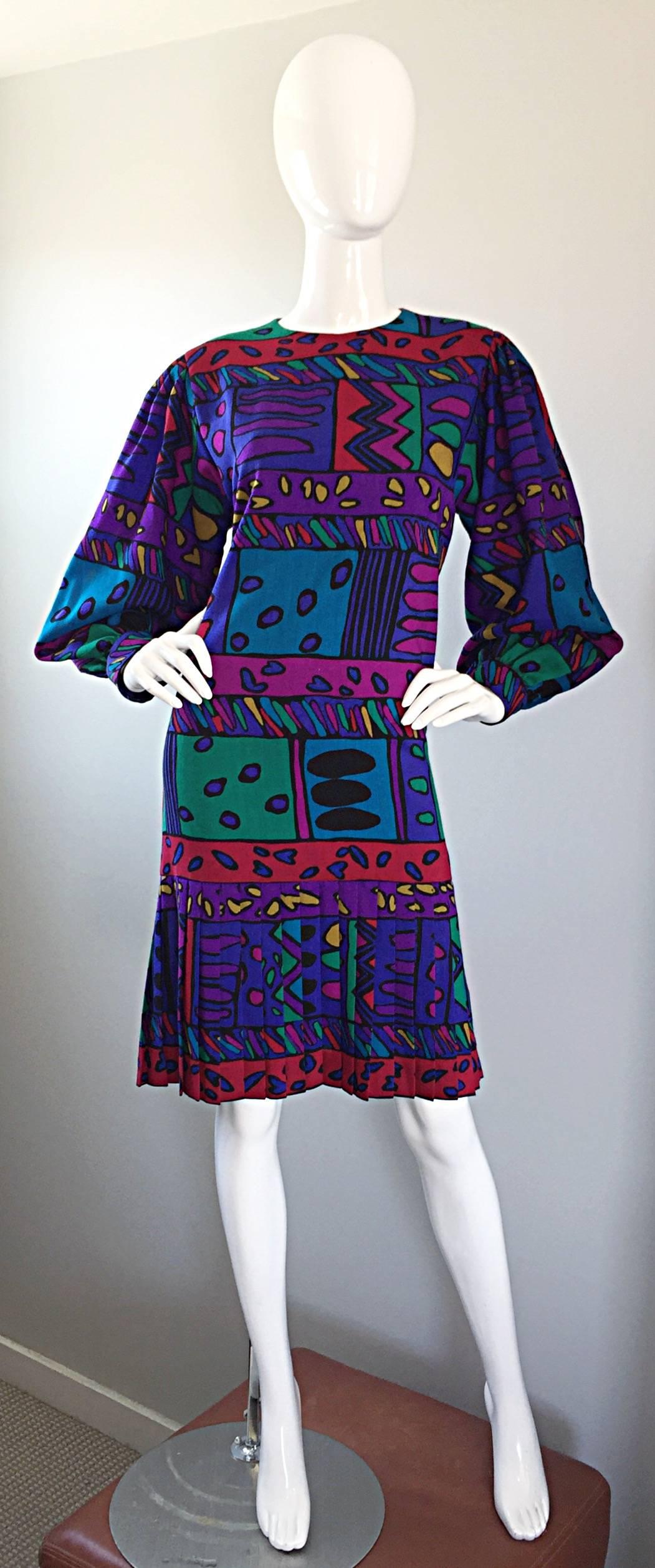 Such a fun HELGA HOWIE colorful op-art dress! Soft cotton with vibrant hues of purple, blue, pink, fuchsia, green, red, yellow and orange! Hearts in various shapes and sizes printed throughout. Flattering drop waist, with knife pleats at the hem of