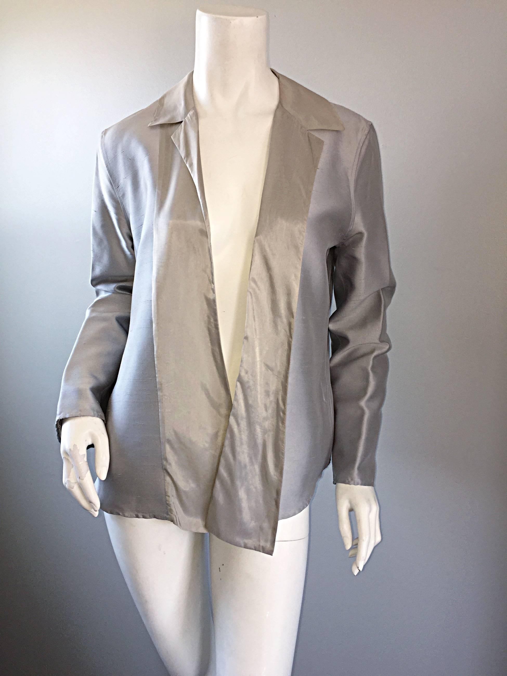 Beautiful 90s vintage JIL SANDER 'Minimalist' silver silk metallic asymmetrical open front blazer / jacket! So much detail in this wonderfully constructed gem! One collar is slightly larger than the other, and lead to a tuxedo-like shawl that ends