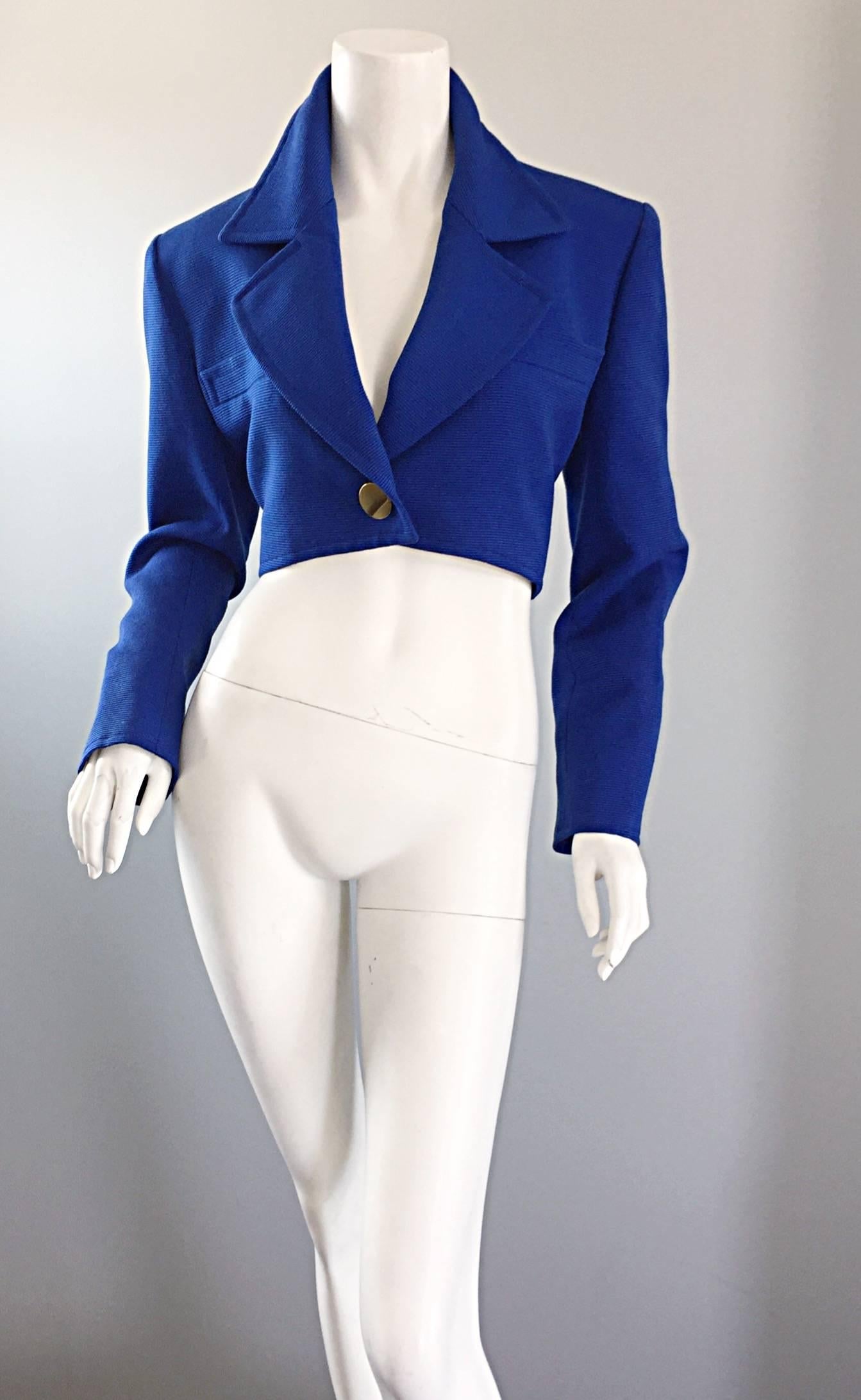 Amazing vintage YVES SAINT LAURENT ( YSL ) Rive Gauche cropped electric blue bolero blazer! Features an oversize gold button at waist and at each sleeve cuff (spare buttons are sewn to the interior). Chic slim fit that looks wonderful on! Fully