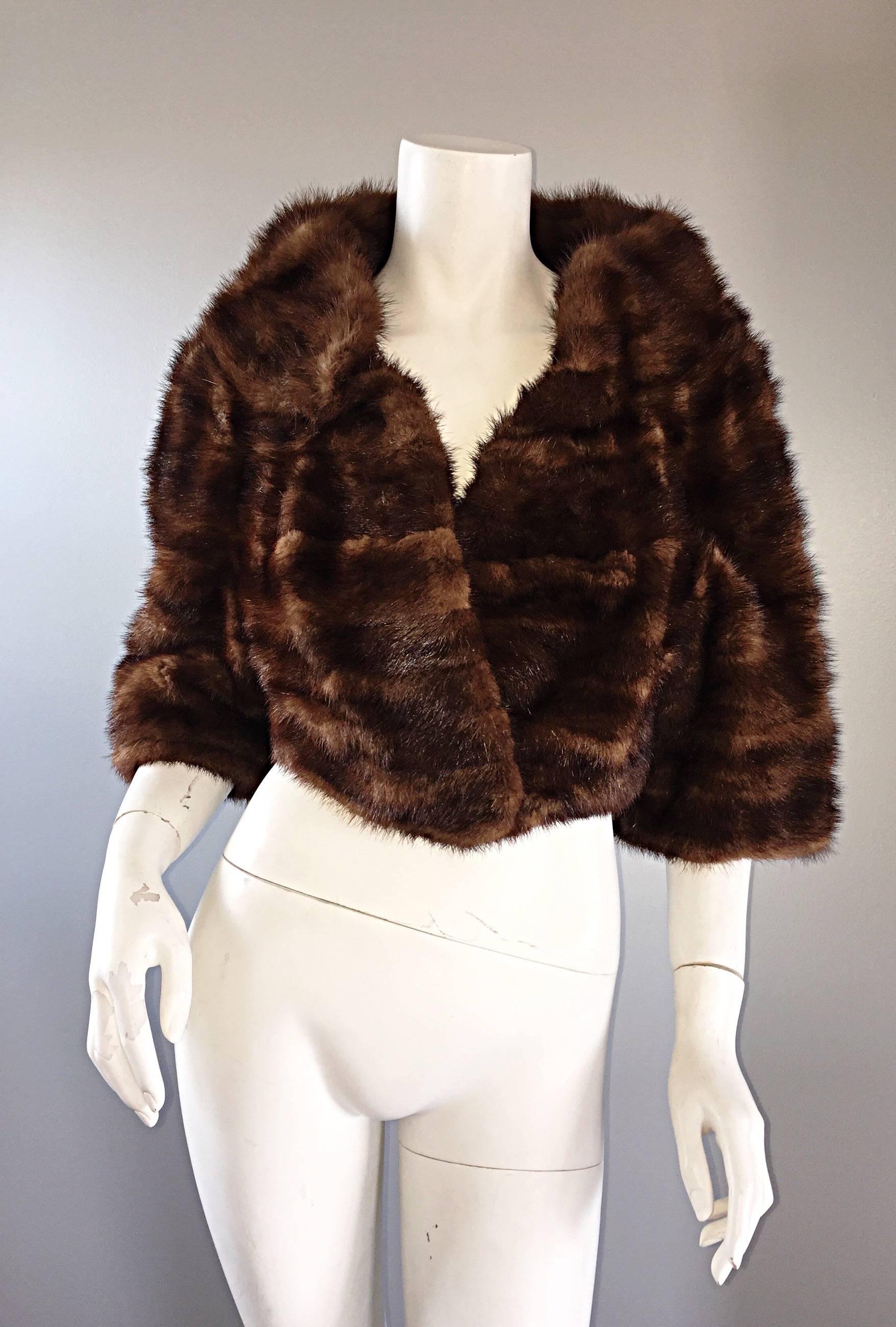 Luxurious 1950 J. CUZZOLINO brown cropped mink chubby! Chic 3/4 sleeves with a feminine collar. Features the finest female mink pelts that are extremely soft, yet highly durable. Couture quality fur that is in excellent condition. Fur snap at waist