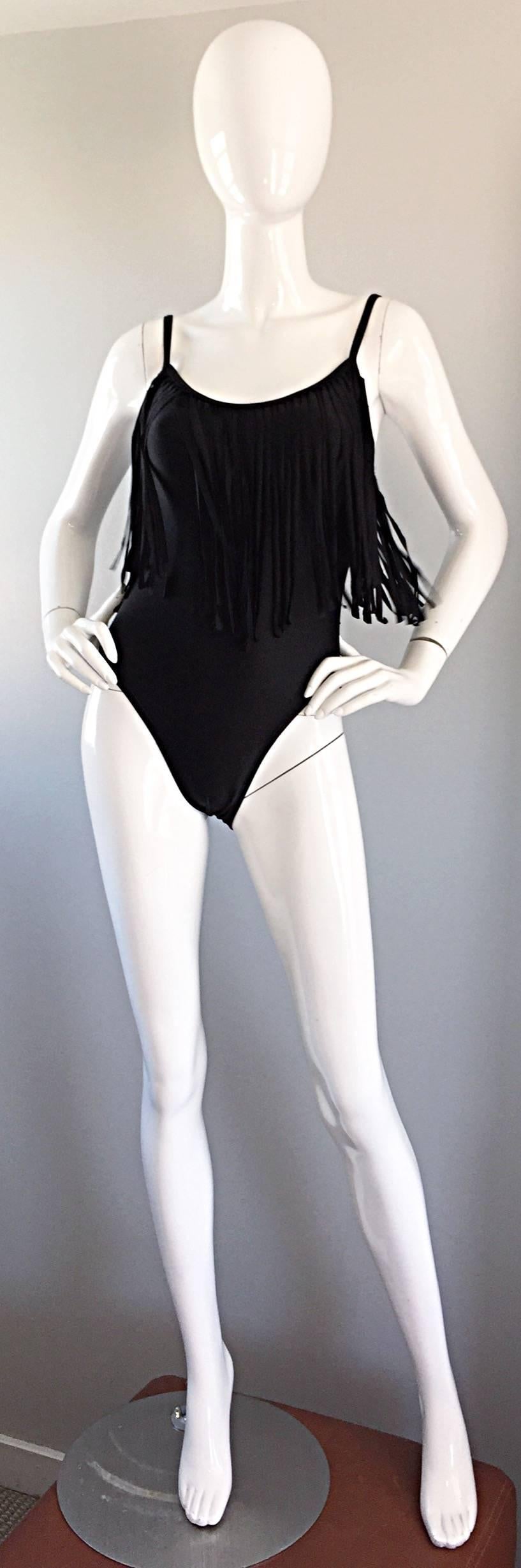 Amazing vintage OSCAR DE LA RENTA one piece black fringe swimsuit or bodysuit! Features allover fringe hanging from the top bodice on front and back. Incredible quality one would only expect form the late, great designer! Super flattering on, and