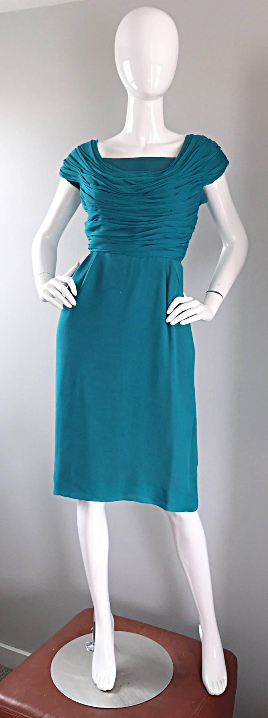 Beautiful 1950s ELLIETTE LEWIS teal blue silk chiffon dress! Pleated ruched bodice has a Grecian feel, and features cap sleeves. Flattering straight skirt. Multiple layers of soft silk chiffon. Full metal zipper with hook-and-eye closure. Vibrant