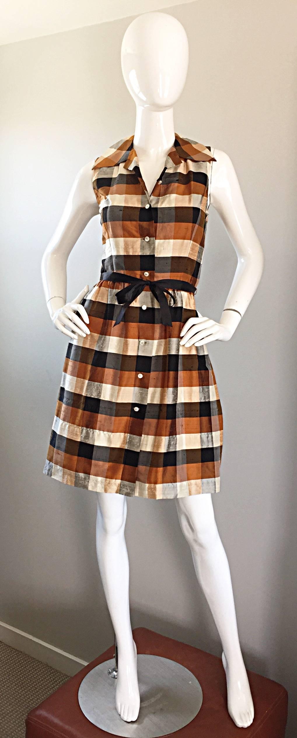 Chic ISAAC MISRAHI vintage silk shirt dress! 1990s does a take on the 1950s in a classic sleeveless shirt dress! Beautiful autumnal tones of brown, tans, ivory, and black in a great plaid print. Removable black silk bow belt. Functional buttons up