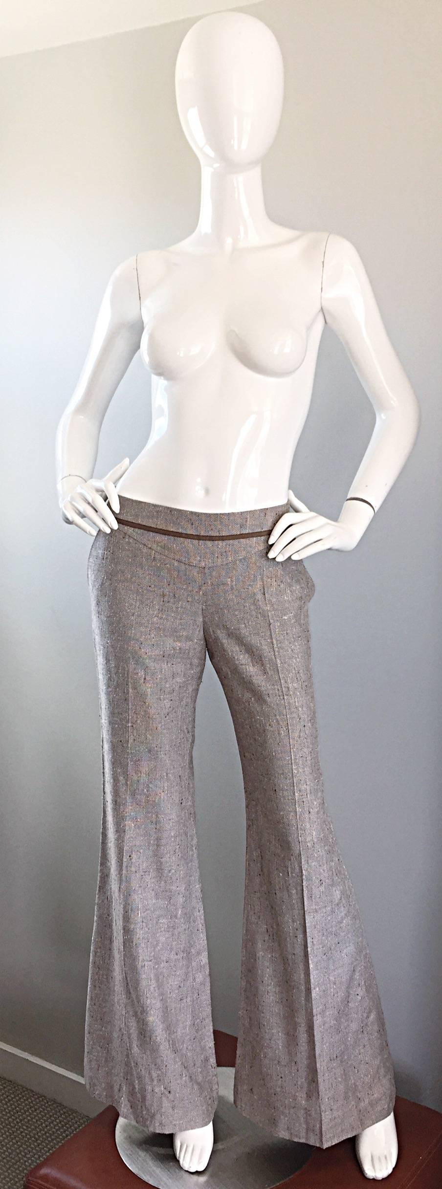 Brand new with tags ESCADA low rise beige, light brown and ivory tweed bell bottom trousers! Insanely chic with the current wide leg trend! Features pockets at both sides of the waist and one on the rear. Hidden zipper up the side with interior