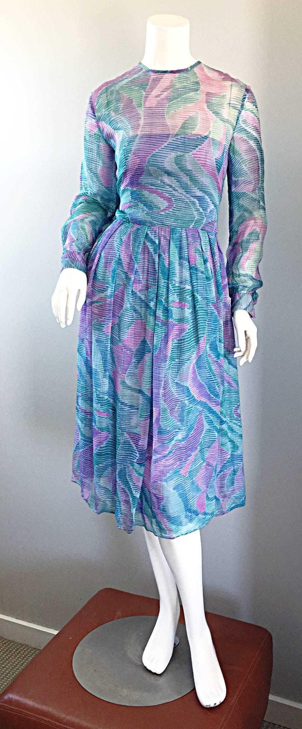 Beautiful late 1970s RICHILENE chiffon dress! Probably the finest and softest chiffon that I have ever felt. Such a pretty watercolor print in purple, pink, and teal! Semi sheer above the bust and sleeves. Wonderful tailored fit is super flattering!