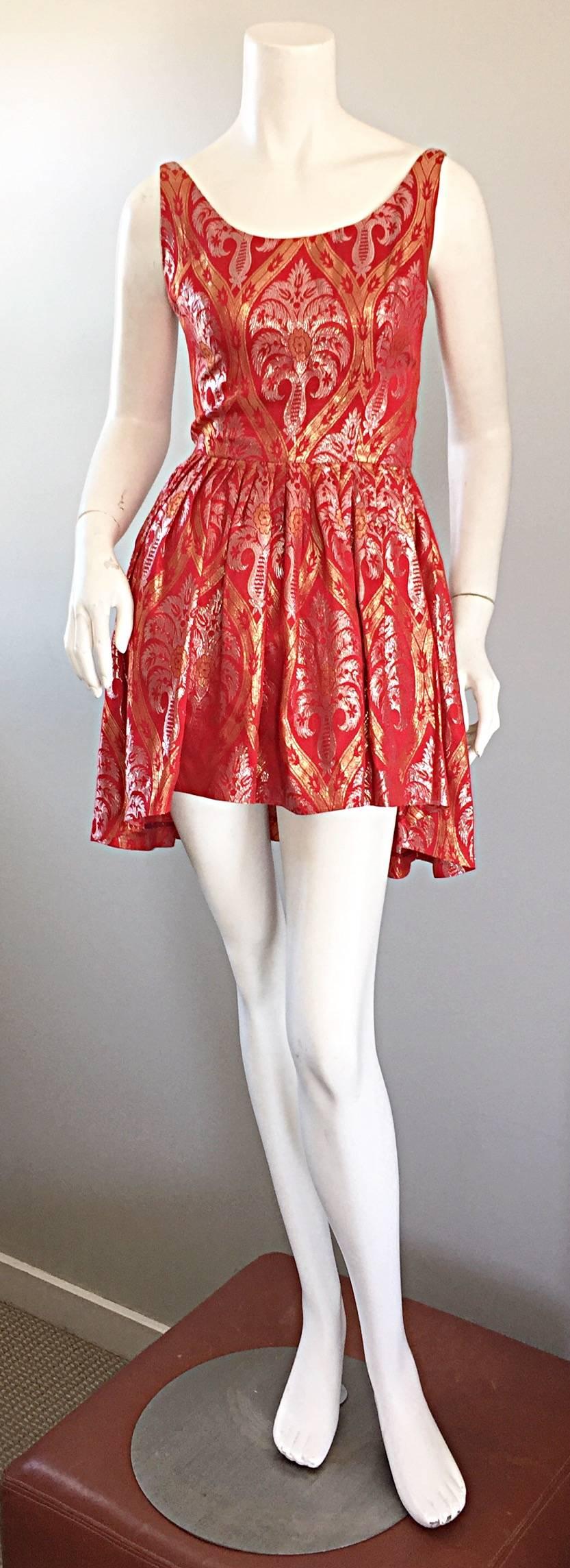 Gorgeous vintage 50s SILVANO OF ROMA FOR HEISER red silk dip hem mini dress or top! Hard to find designer is hugely sought after! Features an all-over metallic brocade pattern in gold and silver. Full skirt that is longer in the back. Flattering