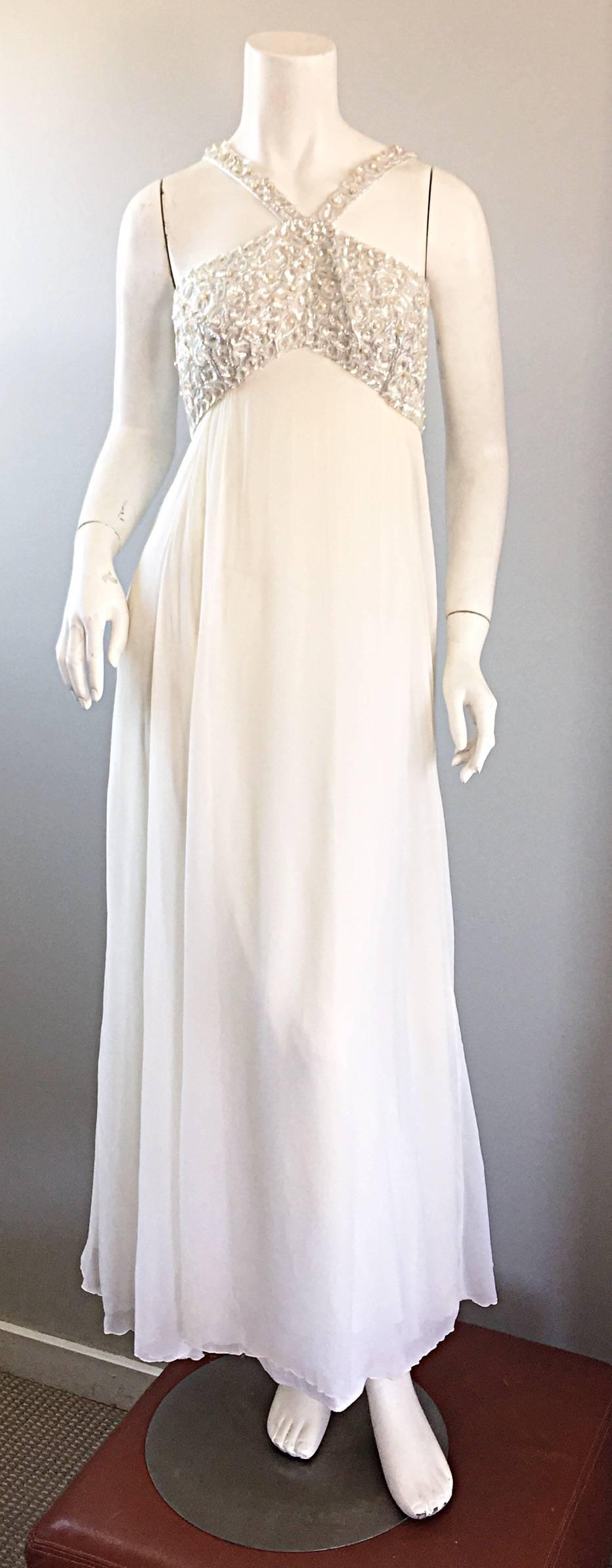 Ethereal vintage EMMA DOMB 1960s white silk chiffon empire waist beaded gown! Words cannot even begin to describe how beautiful this gem is! Would be PERFECT as a wedding dress! Features hand-sewn iridescent sequins and pearls on the front and back