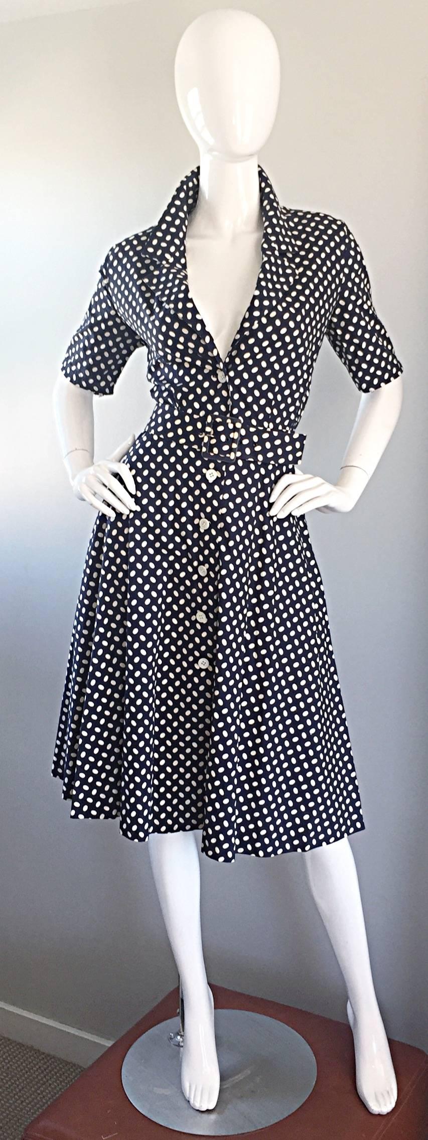 Adorable 1990s does 1950s French cotton dress by J. TIKTINER! Navy blue and white polka dots, with matching belt. Buttons up the bodice. Full skirt looks fantastic with movement, and on the dance floor (could also accommodate a crinoline for an