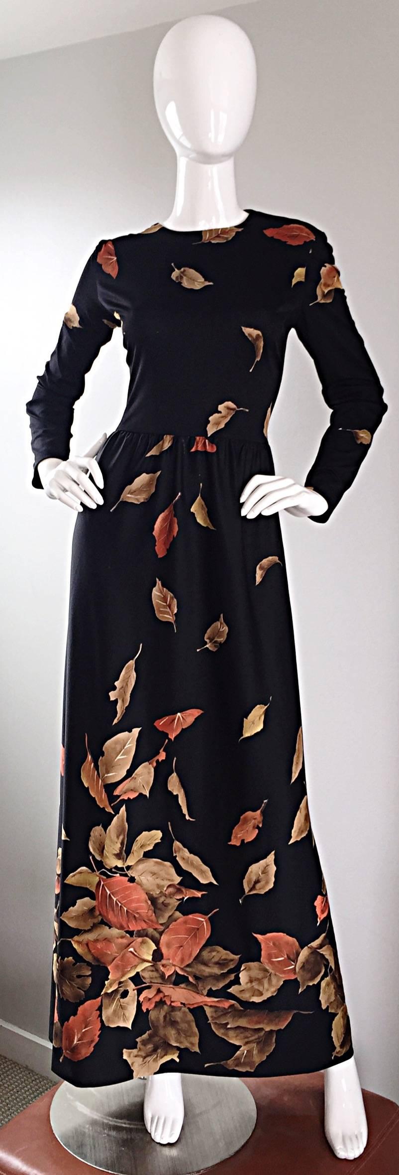 Whimsical 1970s YVES JENET black long sleeve jersey maxi dress, with 3D prints of leaves throughout! Sleek bodice with a full ankle length skirt. Full metal zipper up the back. Looks great alone or belted. Pairs nicely with flats, sandals, wedges or