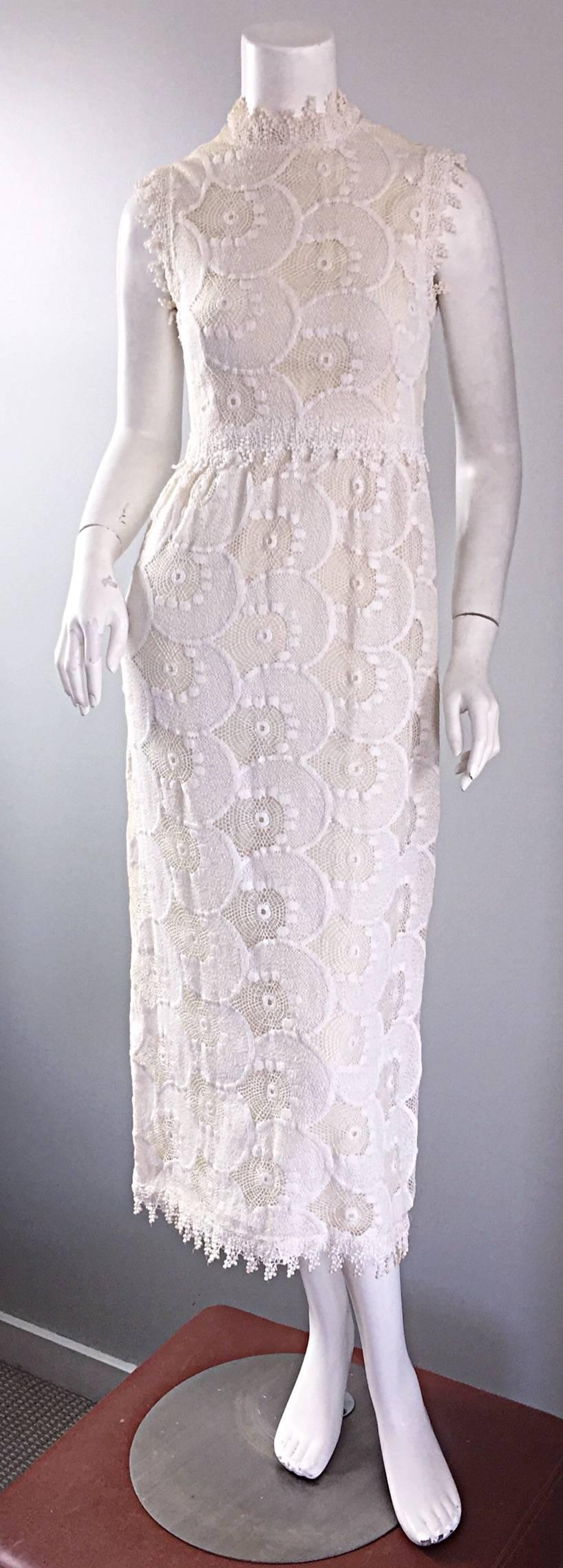 Beautiful late 1960s / early 1970s GLORIA SACHS for MARSHALL FIELD off-white / ivory hand crochet lace dress! Couture quality, with an ivory silk underlay. Features scalloped edges at sleeve cuffs and hem. Full metal zipper up the back with